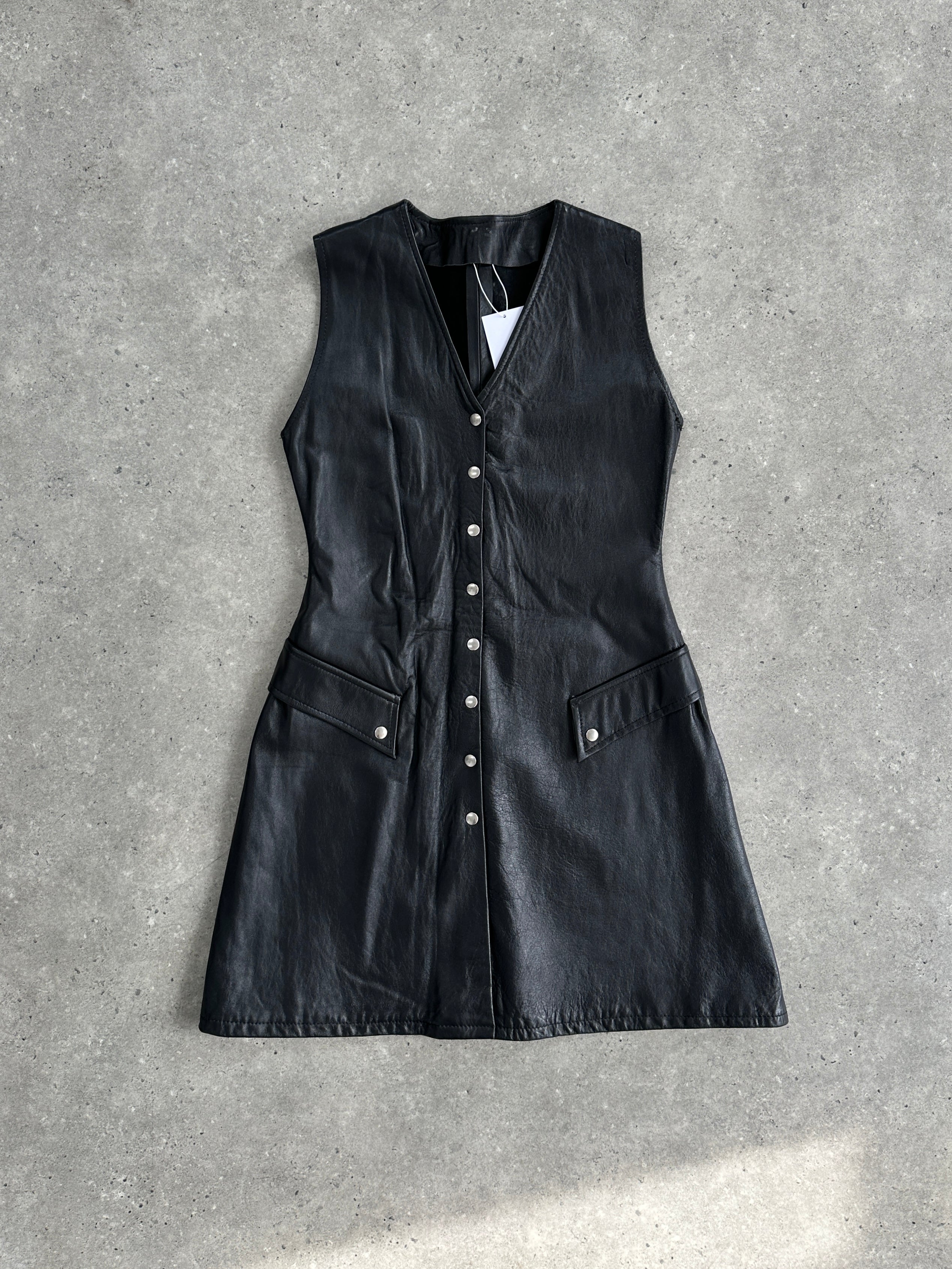 Vintage fitted leather button-up dress in size small, featuring a classic design with a tailored silhouette and vintage style.