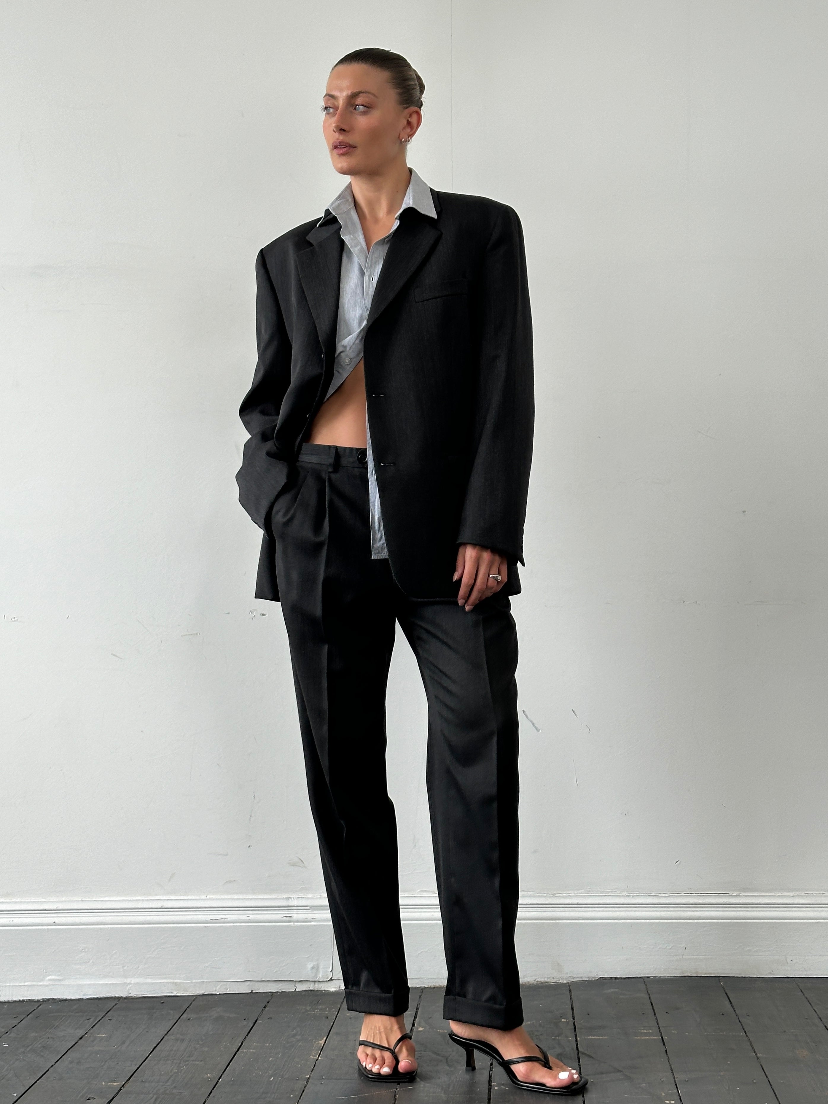 Vintage wool pinstripe single-breasted suit jumpsuit in size 40R/W32, featuring classic tailored design and vintage style.