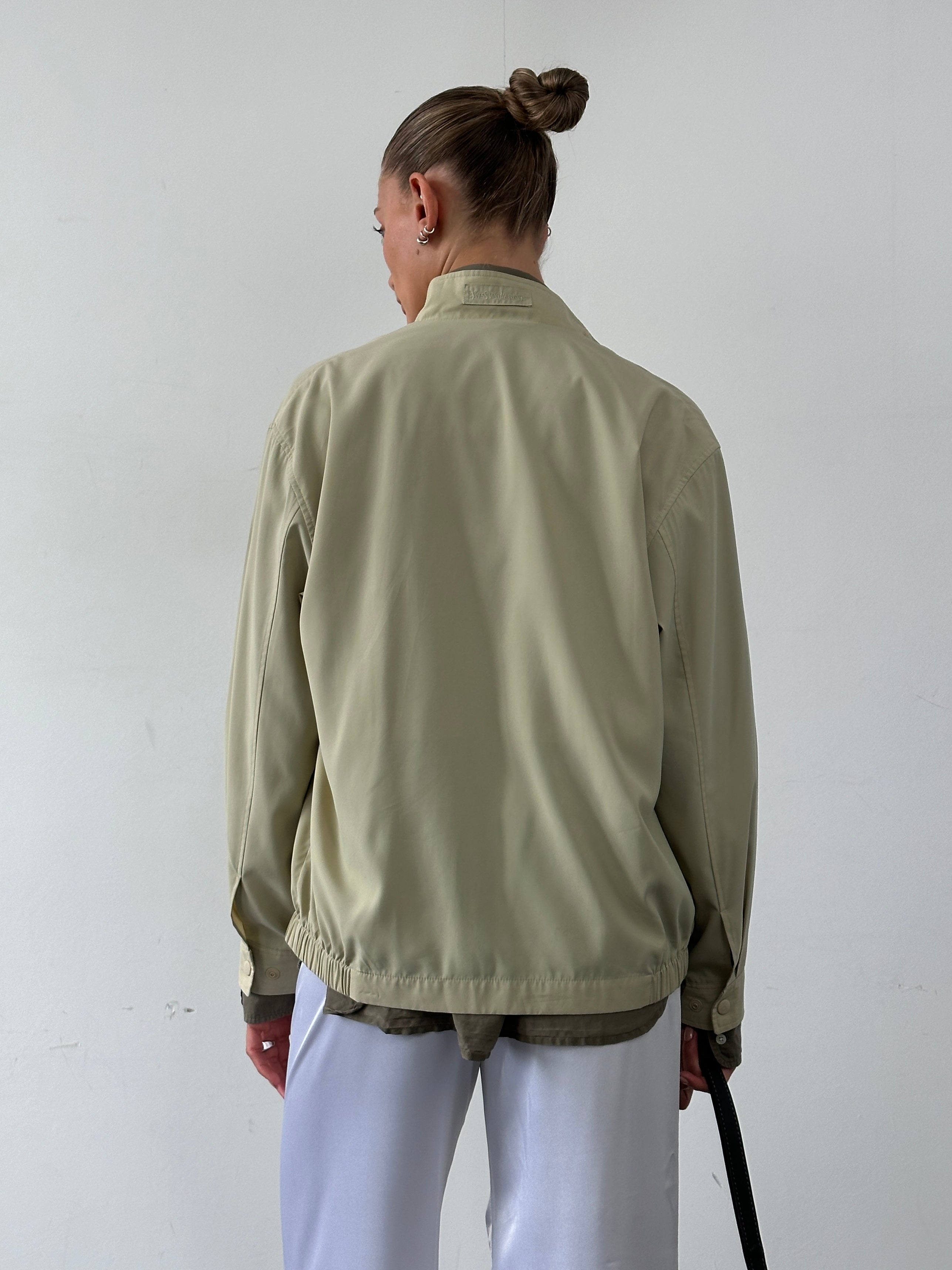 Yves Saint Laurent Pour Homme logo bomber jacket in size M/L, black jacket with YSL branding and ribbed cuffs and collar.