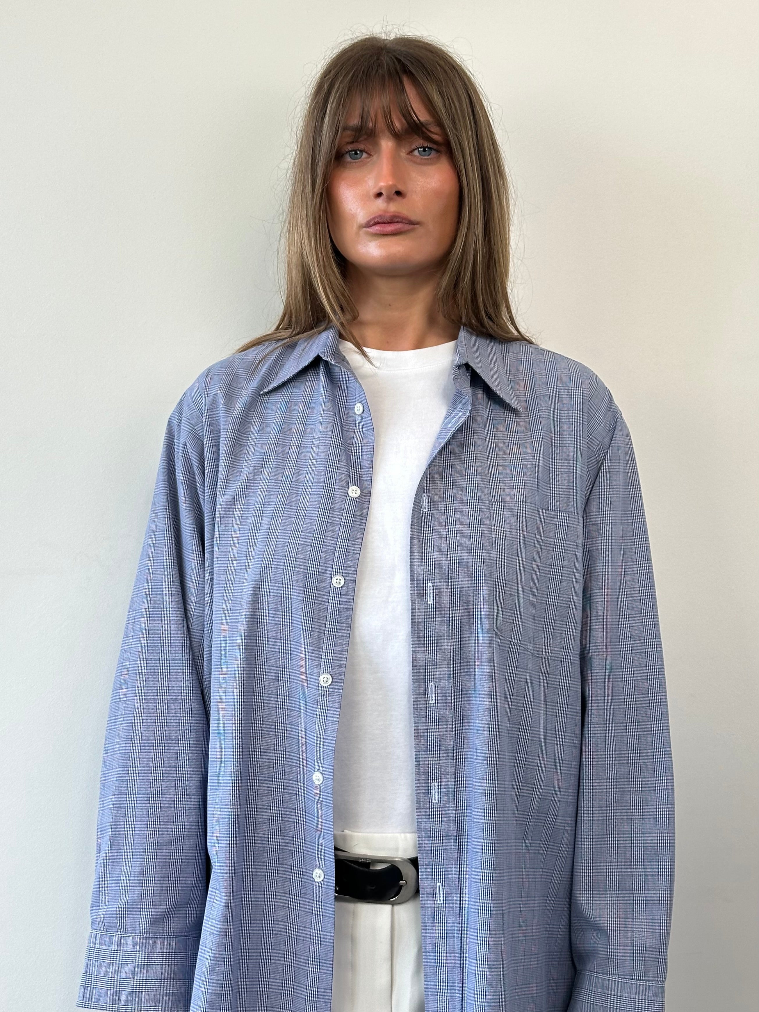 Christian Dior cotton check shirt in size L, featuring a classic plaid pattern and button-down collar, displayed flat on a white background.