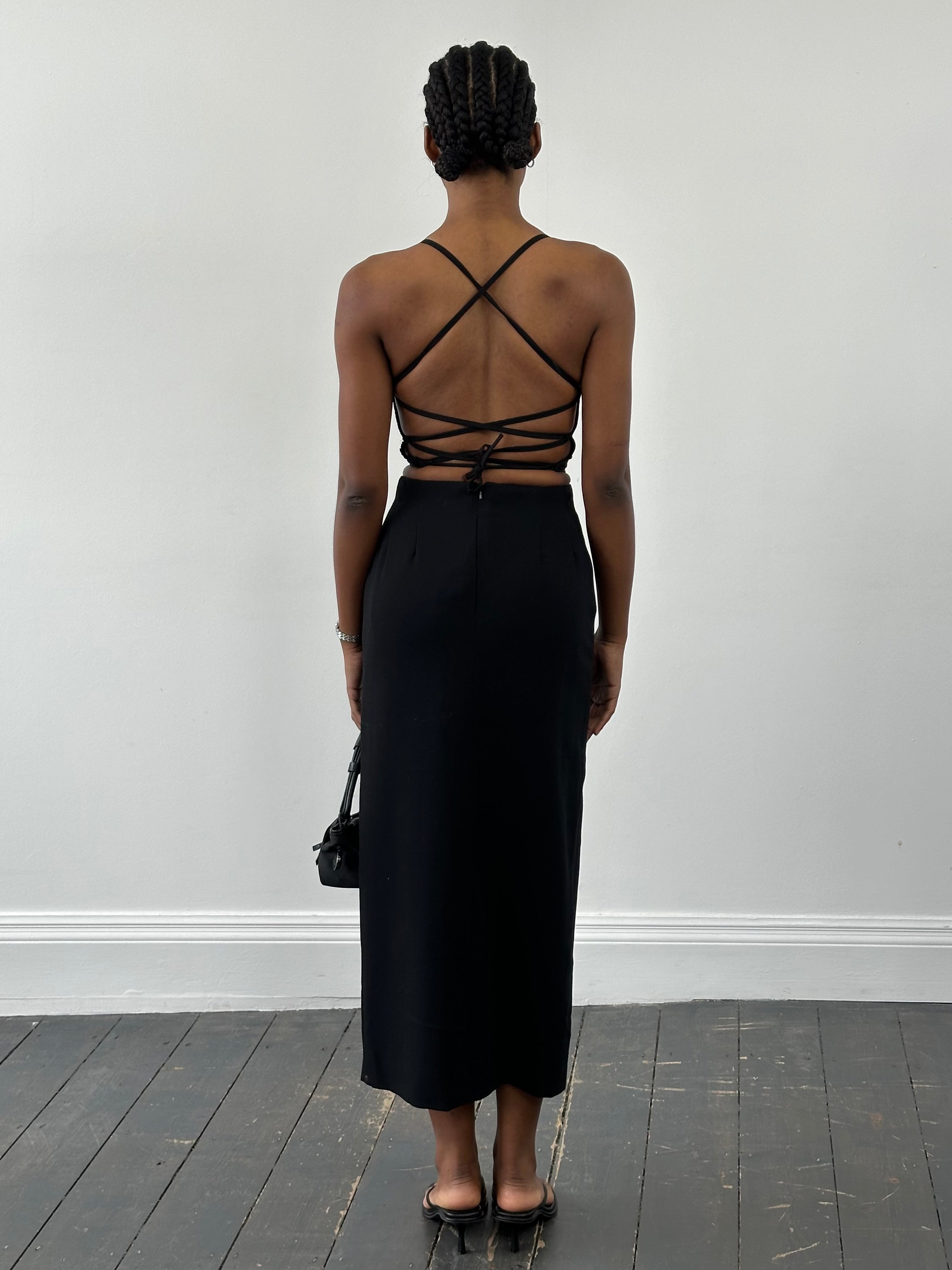 Jaeger 1990s pure wool side split maxi skirt in navy, featuring a high waist and flowing silhouette.