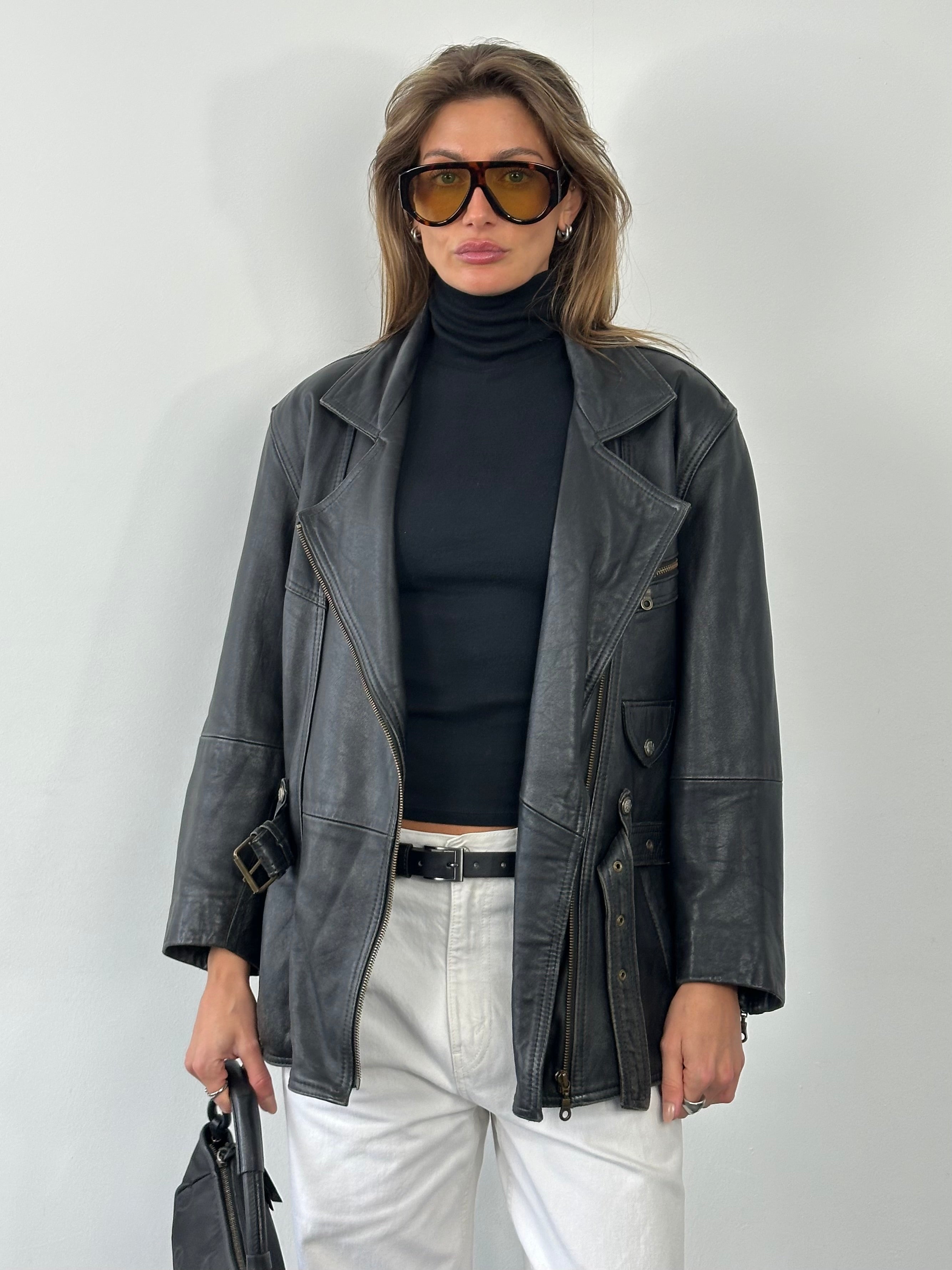 Vintage 1990s leather belted jacket, size M, classic leather jacket with belt, featuring a rugged vintage style and detailed stitching.