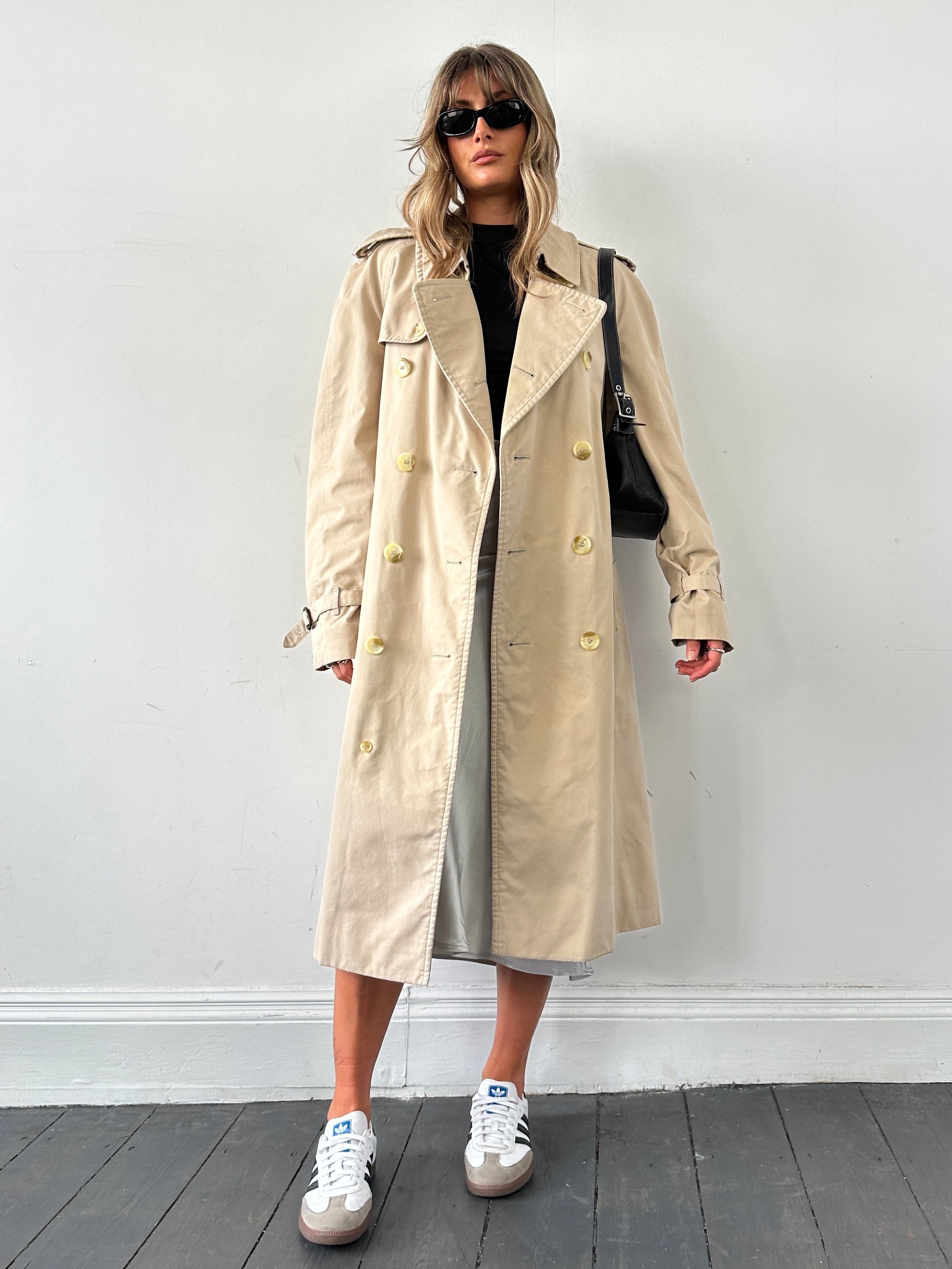 Burberry double-breasted trench coat in XL size, beige color, with classic belt and button details, stylish outerwear for women.