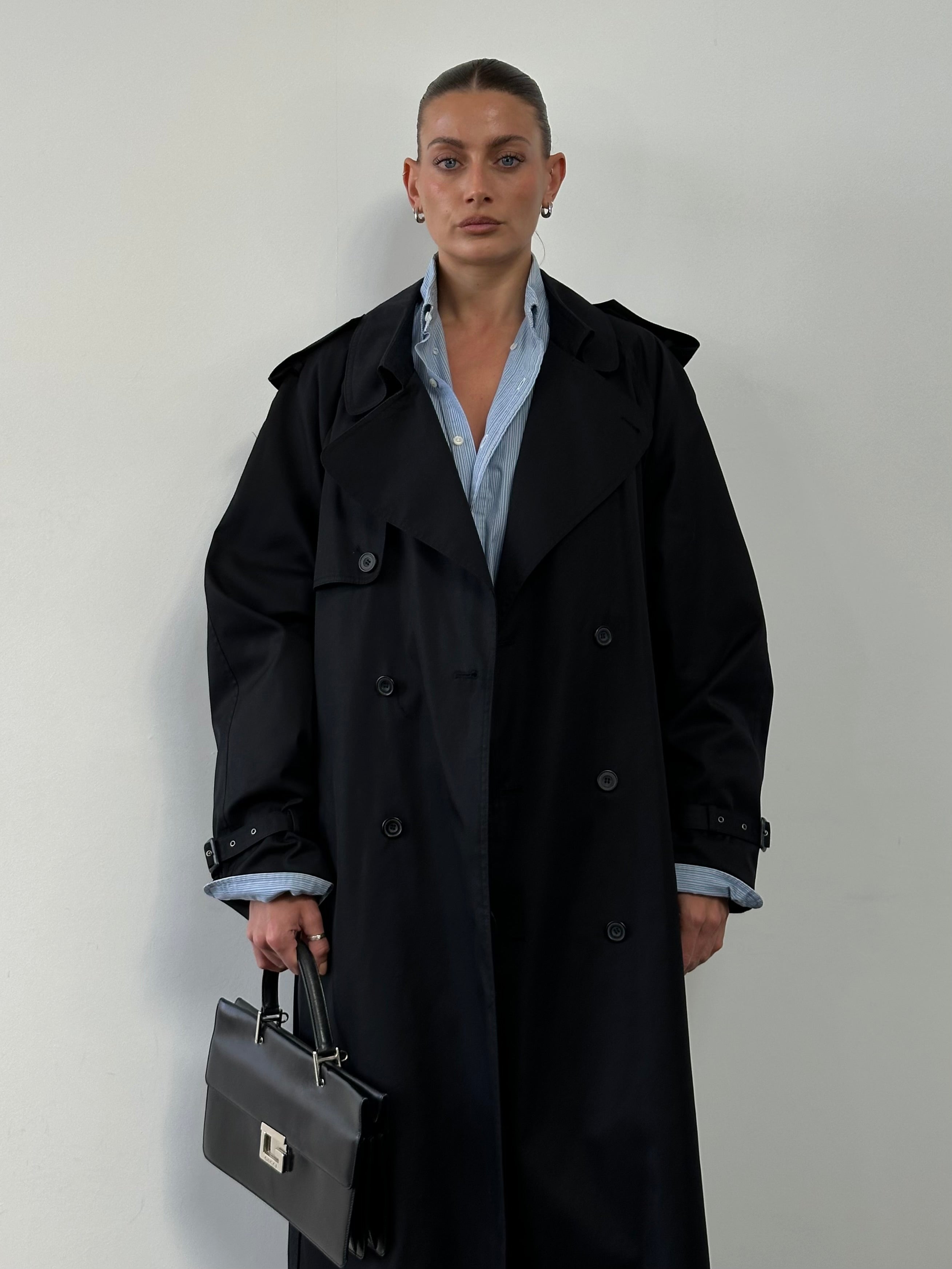 Vintage double-breasted belted trench coat in XL, classic style with lapels and shoulder epaulets, stylish outerwear for women.