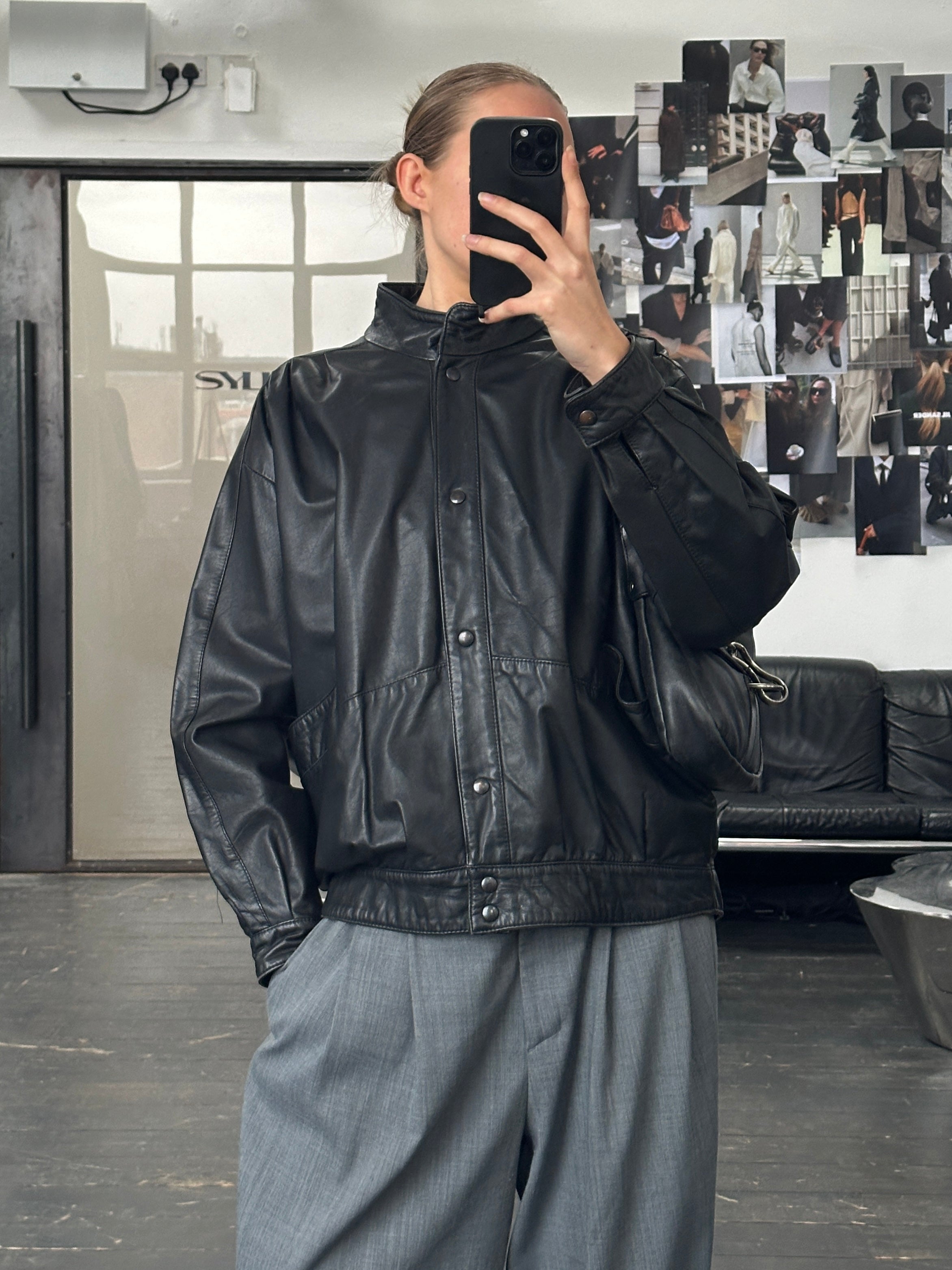Vintage 1990s leather jacket in size M, classic brown leather with a worn-in look, stylish and timeless vintage apparel.