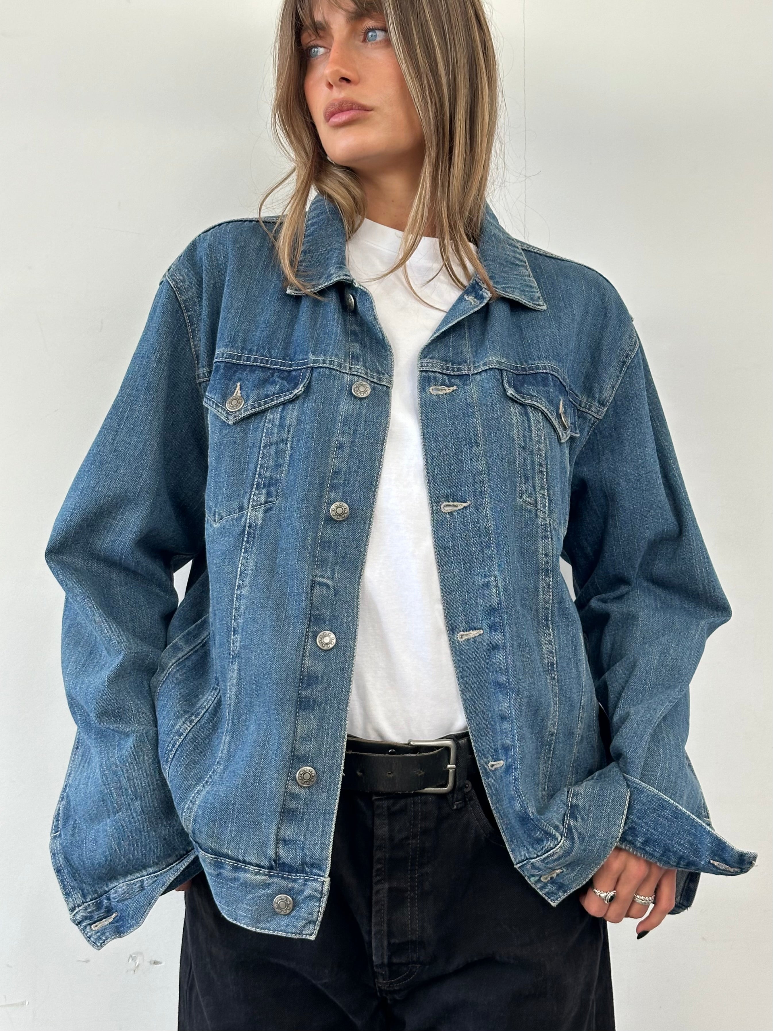 Vintage pure cotton denim jacket in XL size, featuring classic design with button closure and chest pockets.