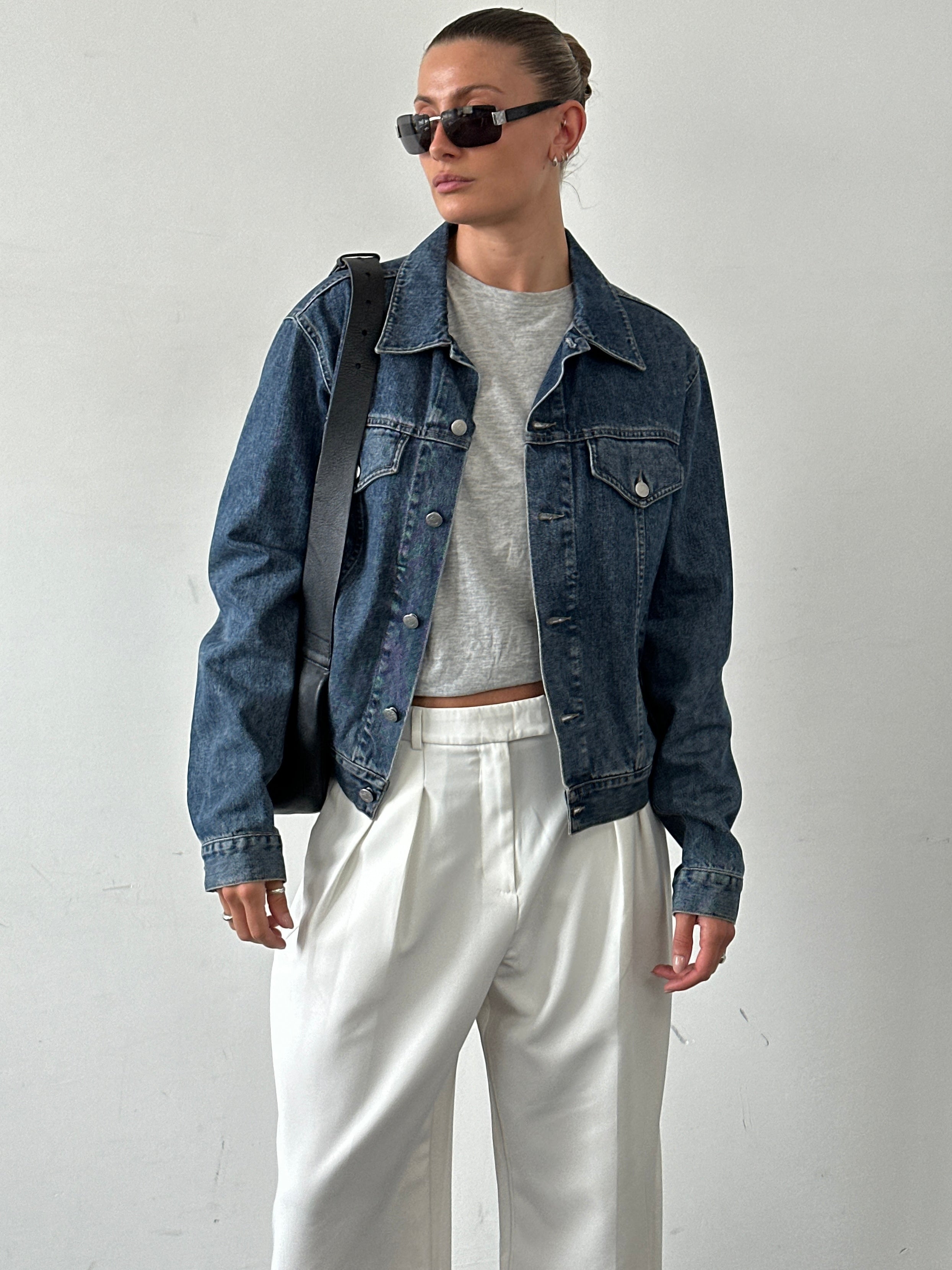 Armani Jeans denim jacket for men, featuring classic blue denim fabric, button closure, and stylish collar details.