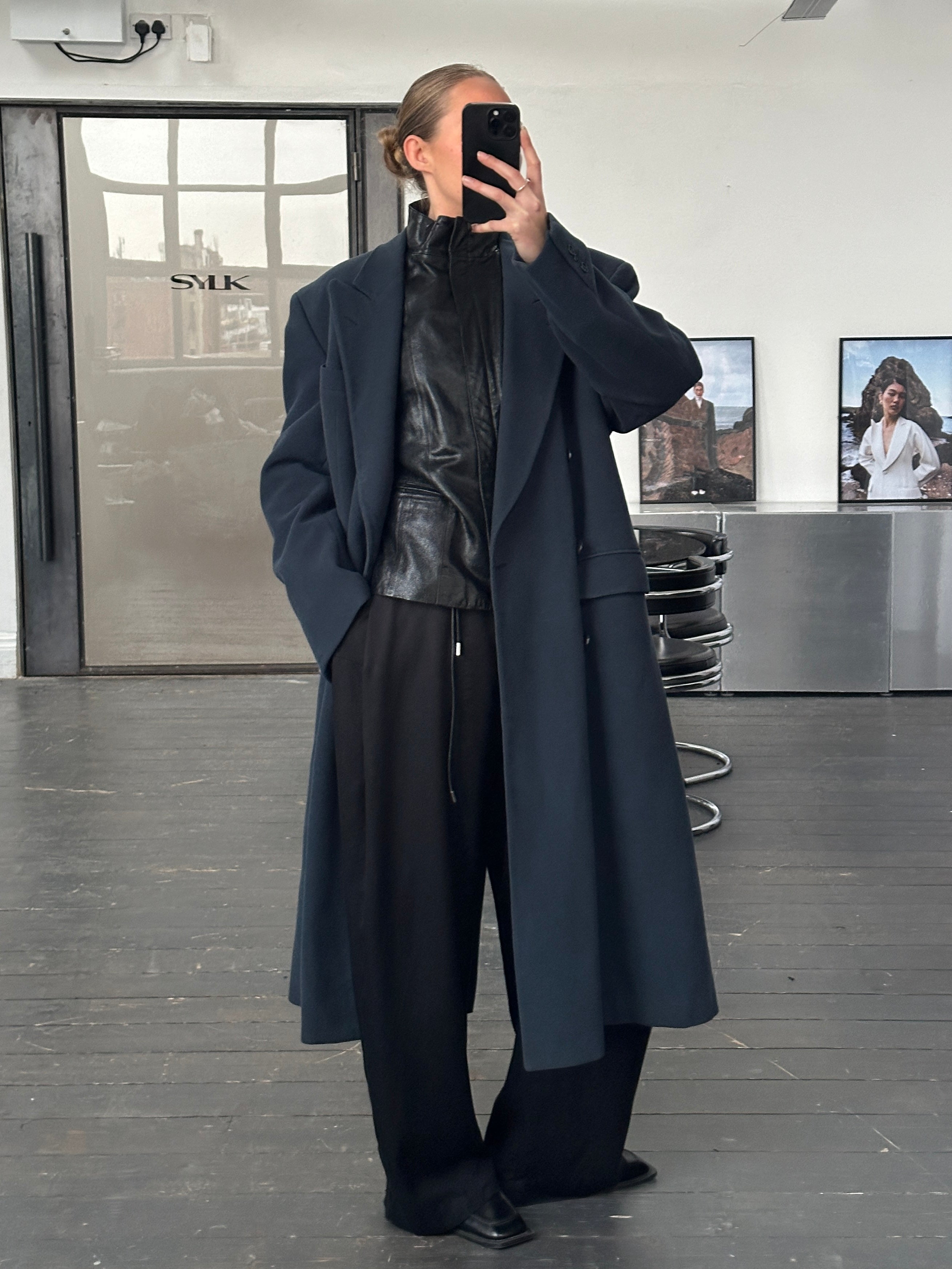 Vintage 1990s high neck double zip leather jacket with long sleeves and classic black leather, size small/medium.