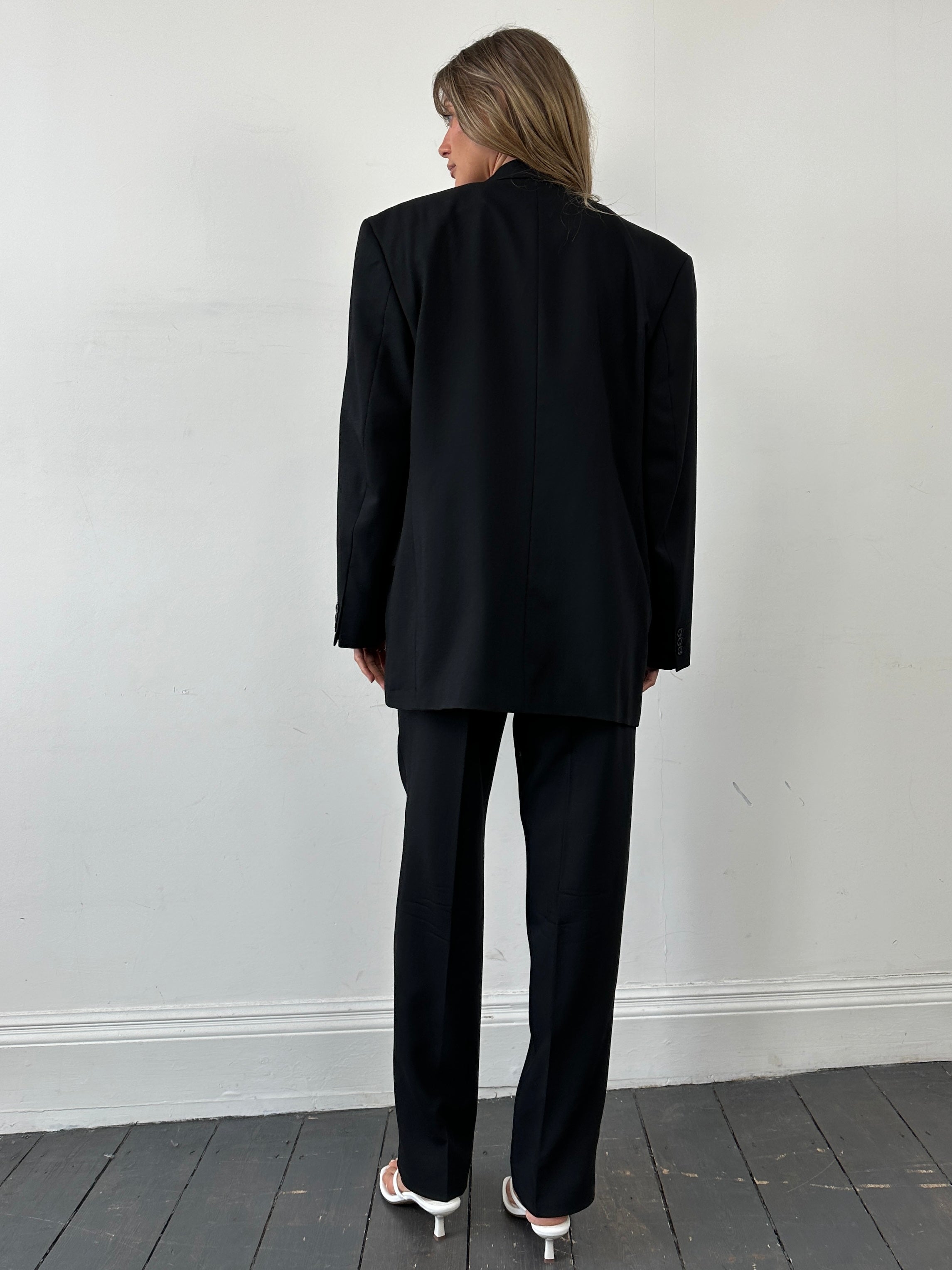 Pierre Cardin pure wool single-breasted suit jumpsuit in size 40R/W34, shown in a tailored design with lapel collar and front buttons.