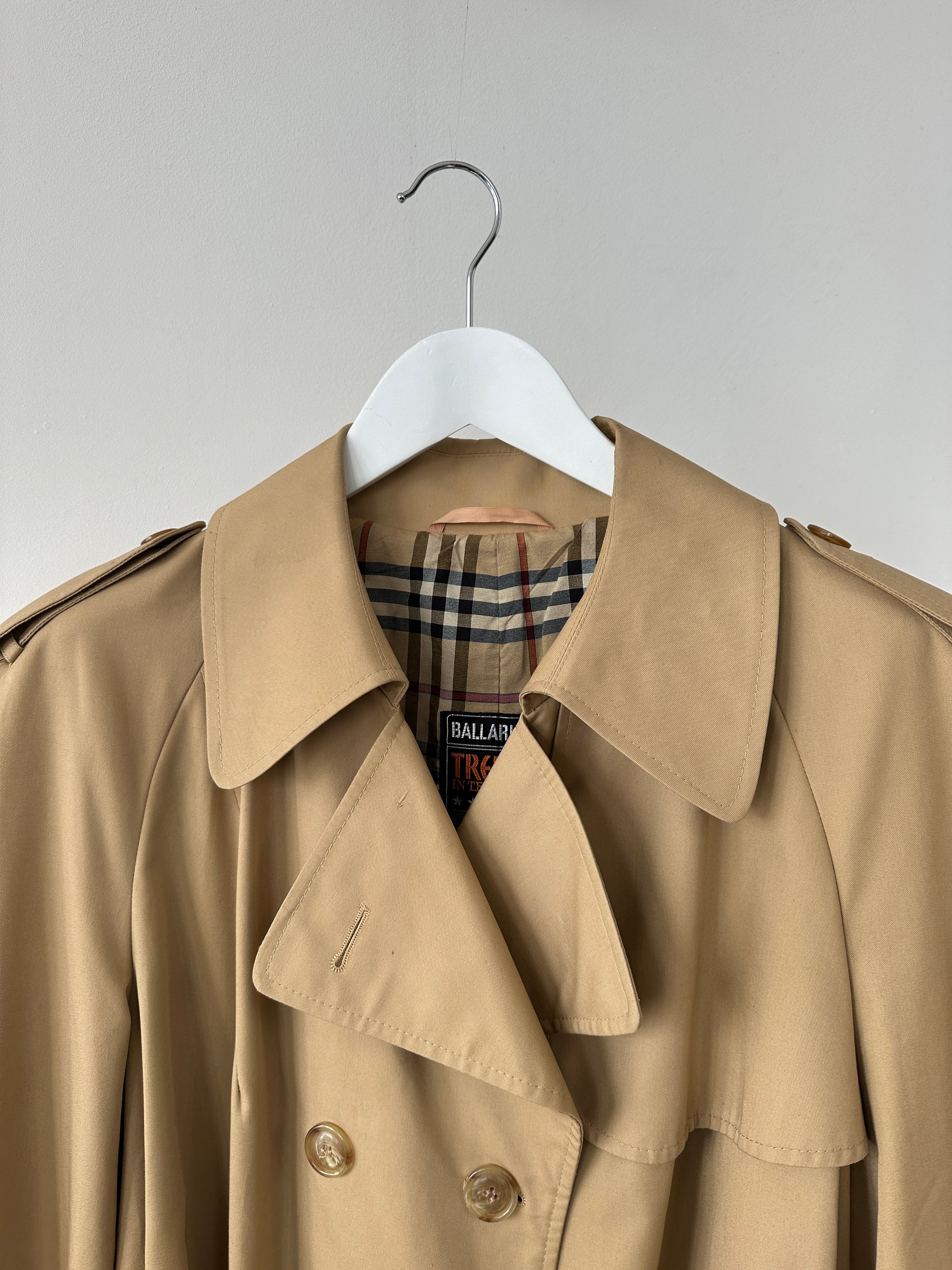 Vintage cotton double-breasted belted trench coat in size L, featuring classic design and timeless style.