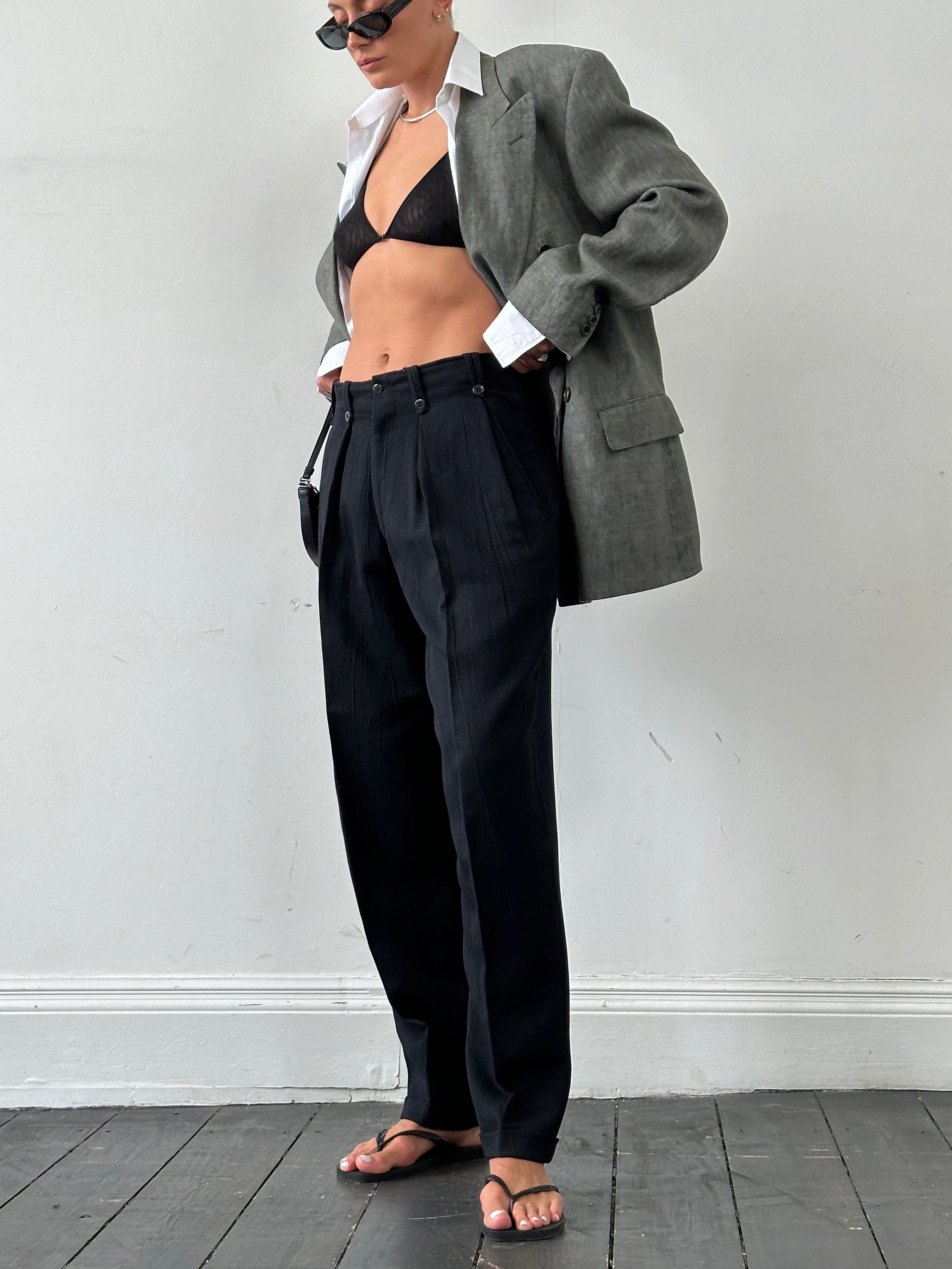 Vintage Italian vintage crinkle tapered leg high-waisted tailored trousers, size W30, with a classic retro design.