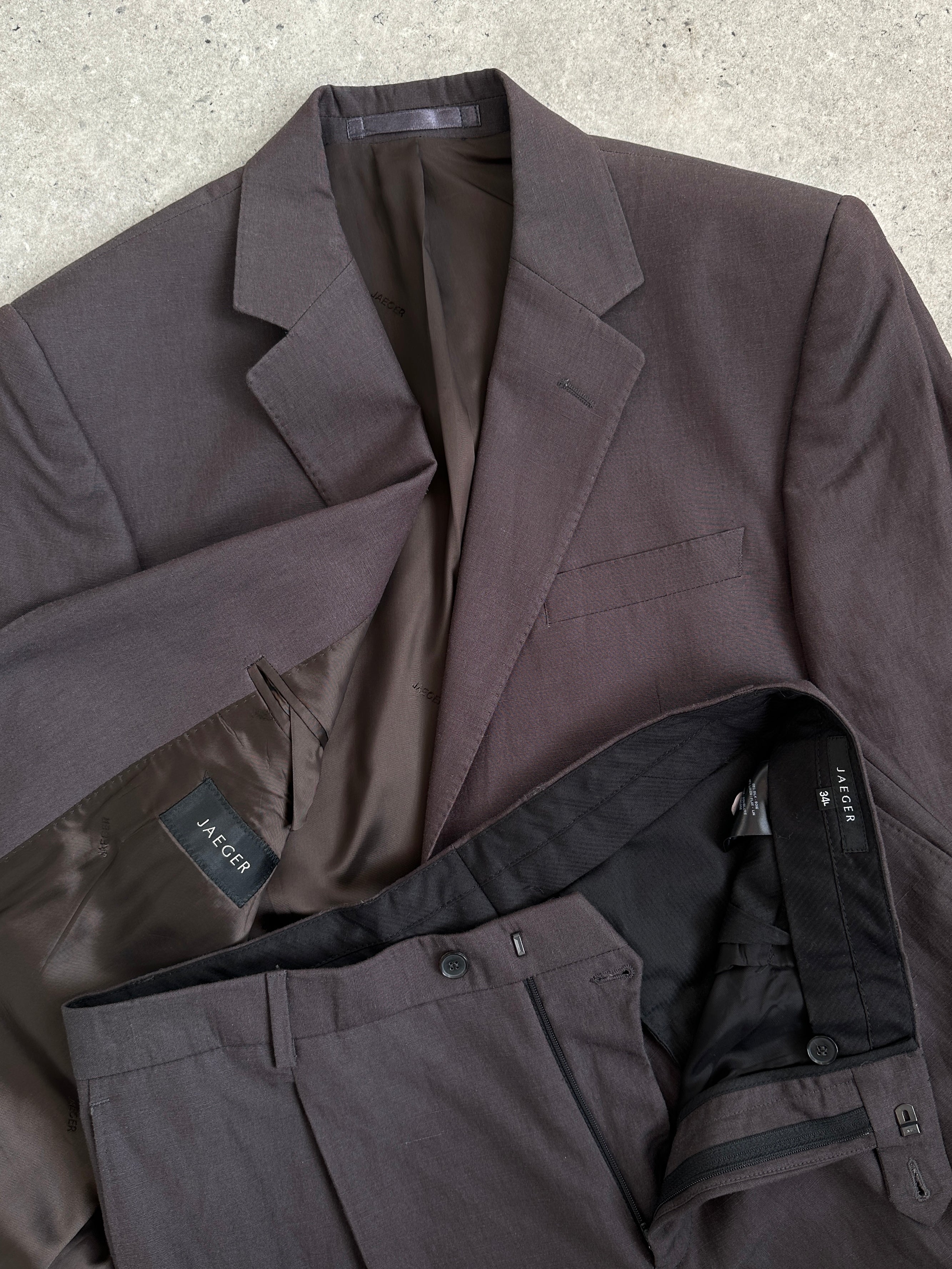 Jaeger silk linen single-breasted jumpsuit in size 40R/34L, featuring a stylish tailored design and elegant fabric details.