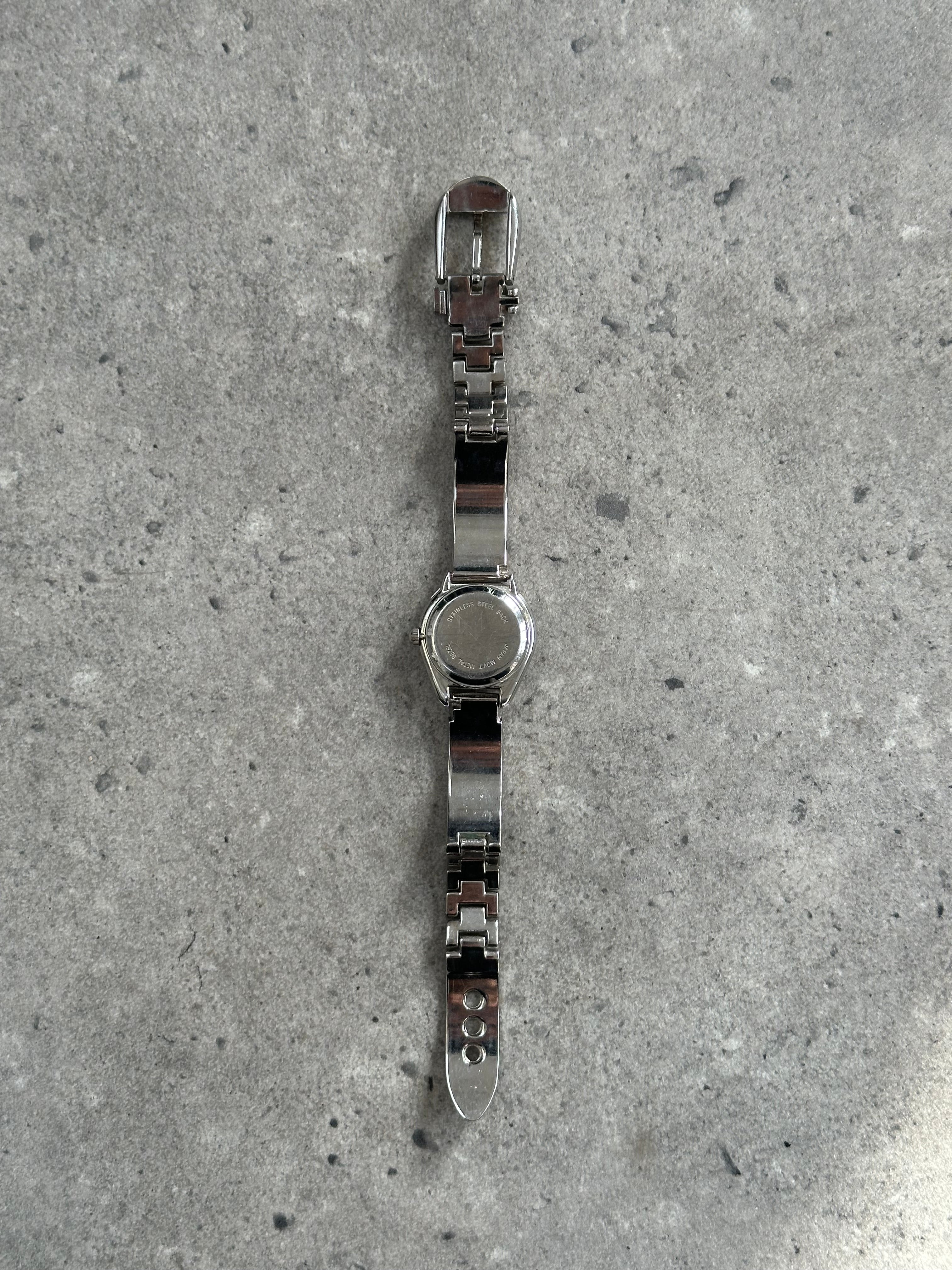 Gucci 1990s stainless steel quartz watch with sleek design and classic round face.