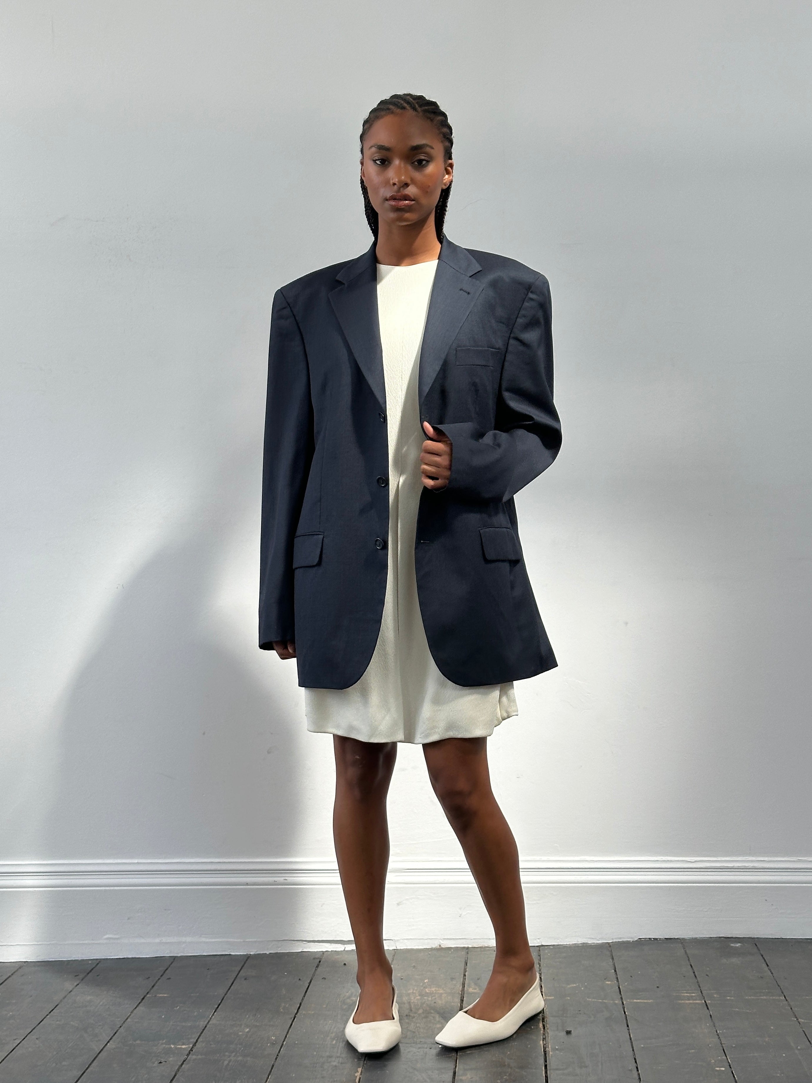 Yves Saint Laurent Pour Homme 1990s pure wool single-breasted blazer in size 42R/XL, tailored with a classic fit and dark navy color.