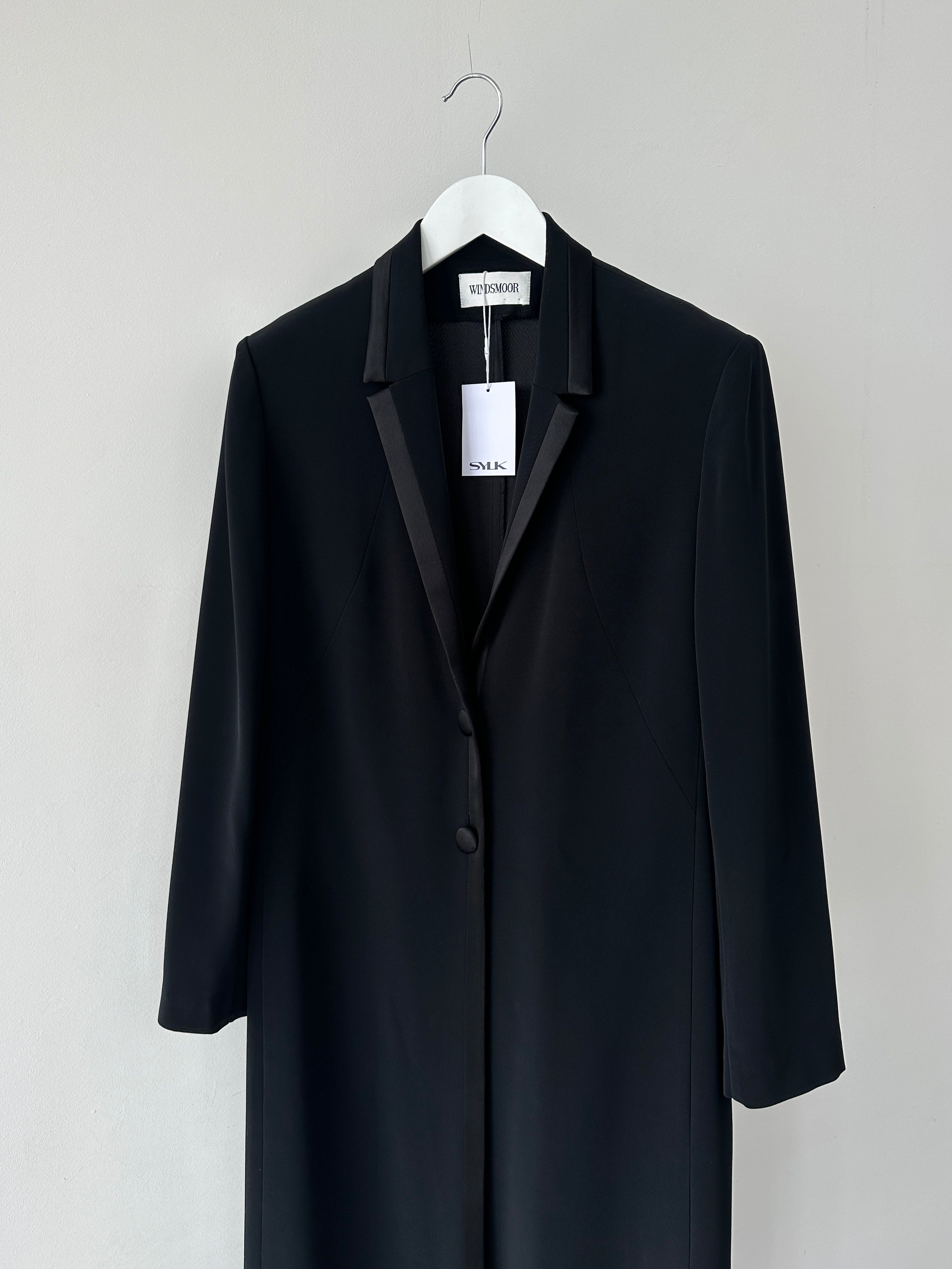 Vintage lightweight tuxedo coat in size small, tailored fit with classic lapels and subtle texture, stylish formal outerwear.