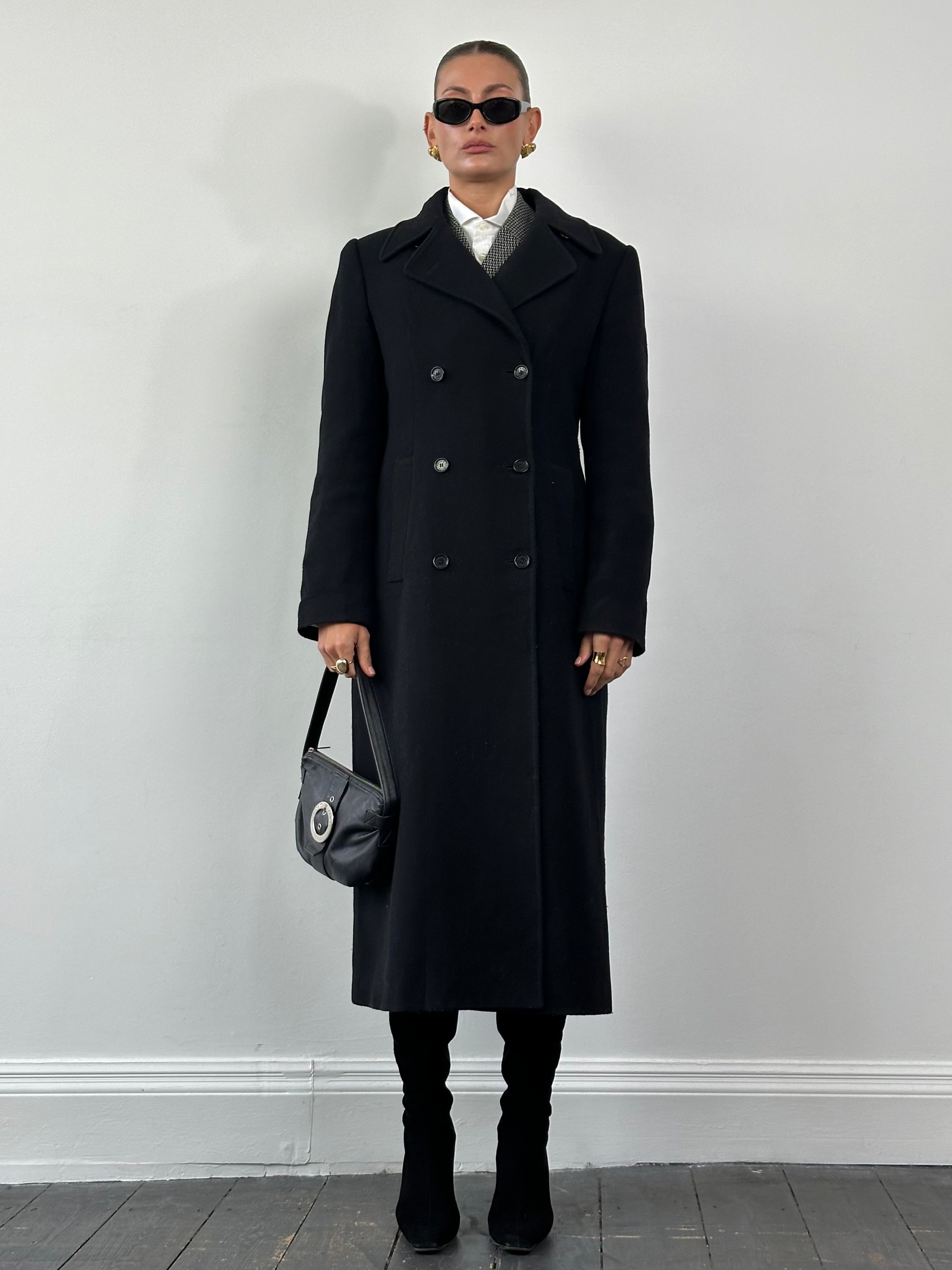 Dolce & Gabbana wool floor-length double-breasted coat in black, featuring wide lapels and classic tailored fit.