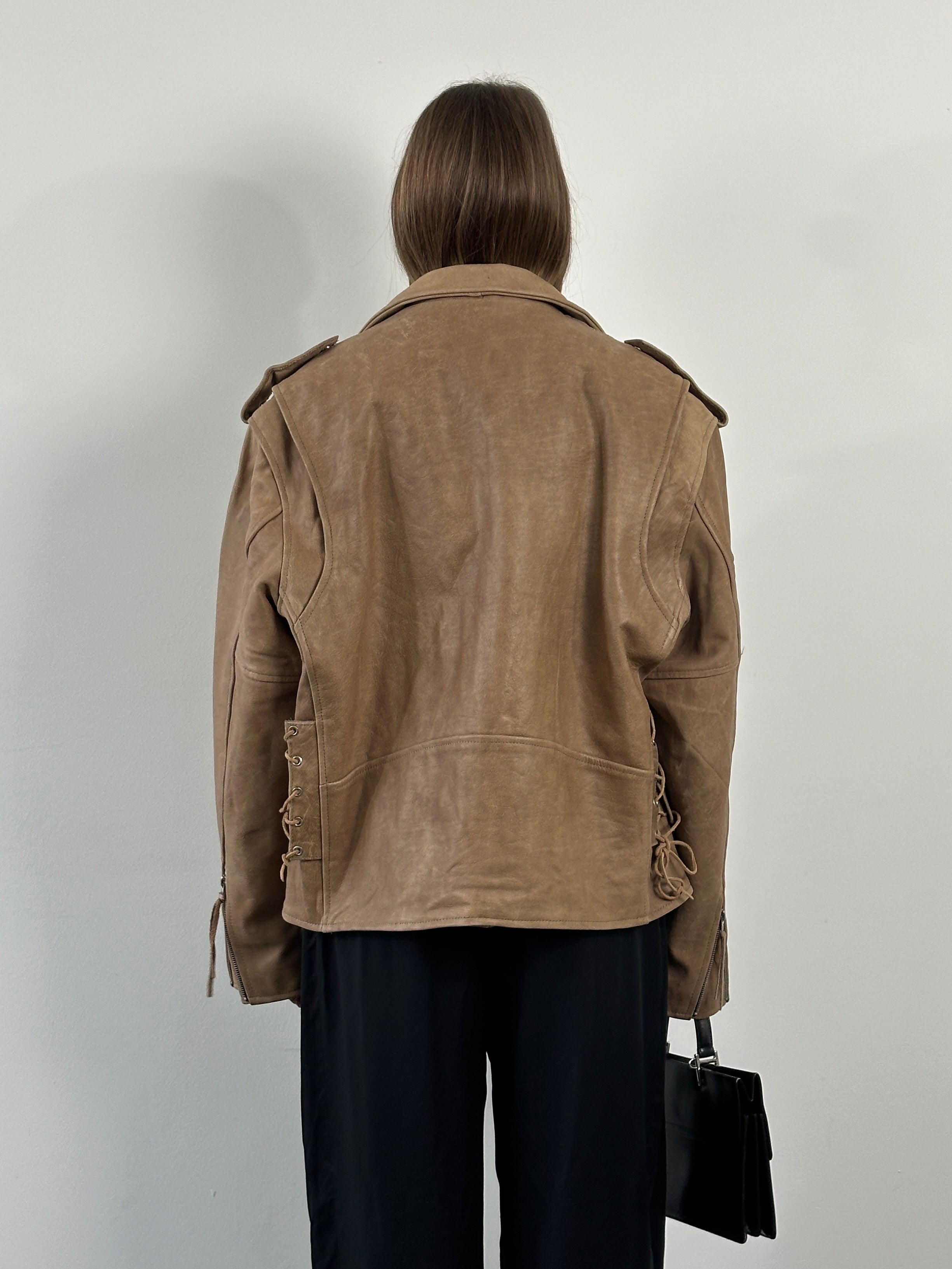 Vintage 1990s leather biker jacket in size XL, featuring classic design and authentic leather material.