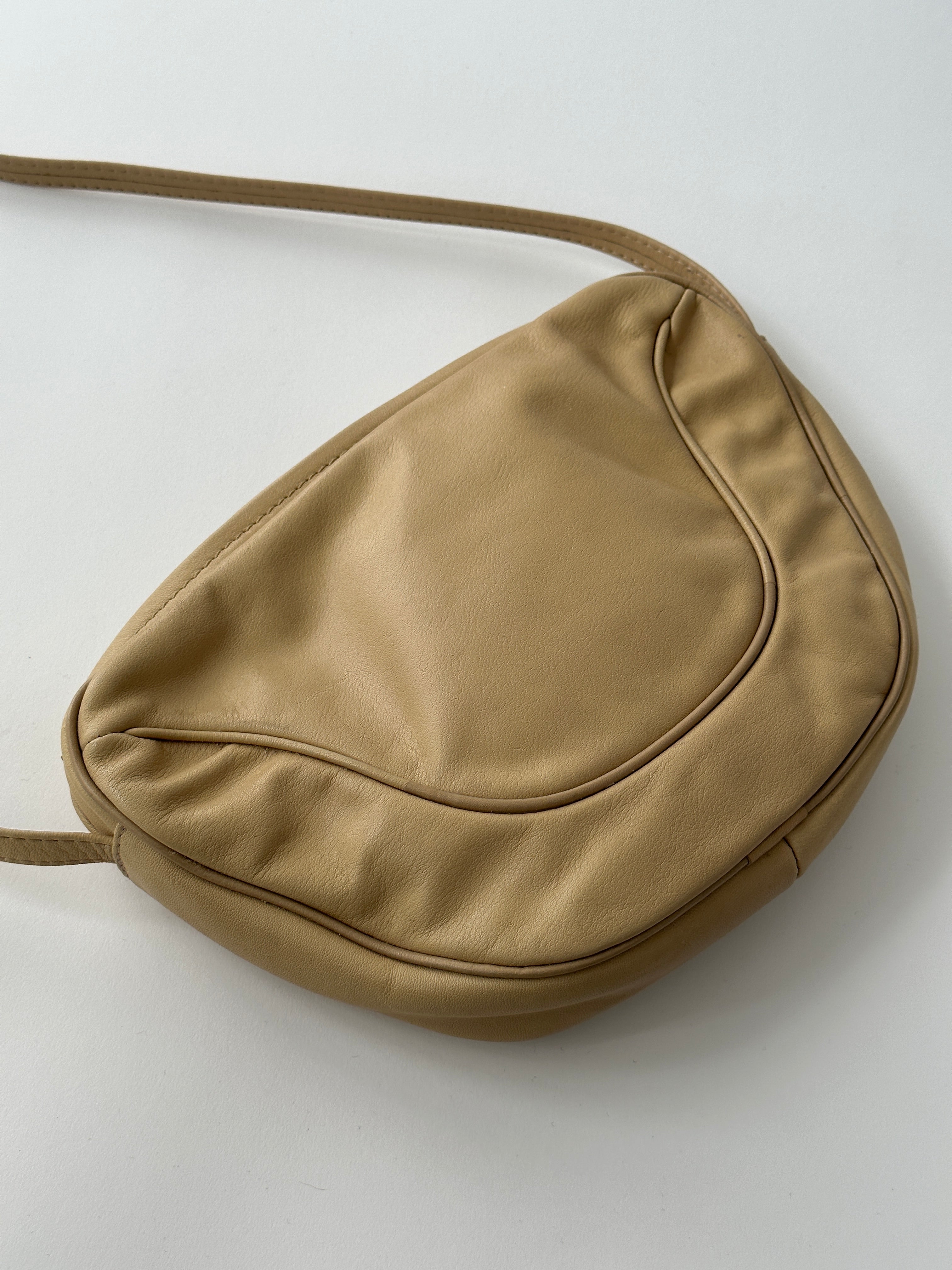 Vintage Faux Leather Crossbody Bag with adjustable strap and classic design, showcasing its textured faux leather material.