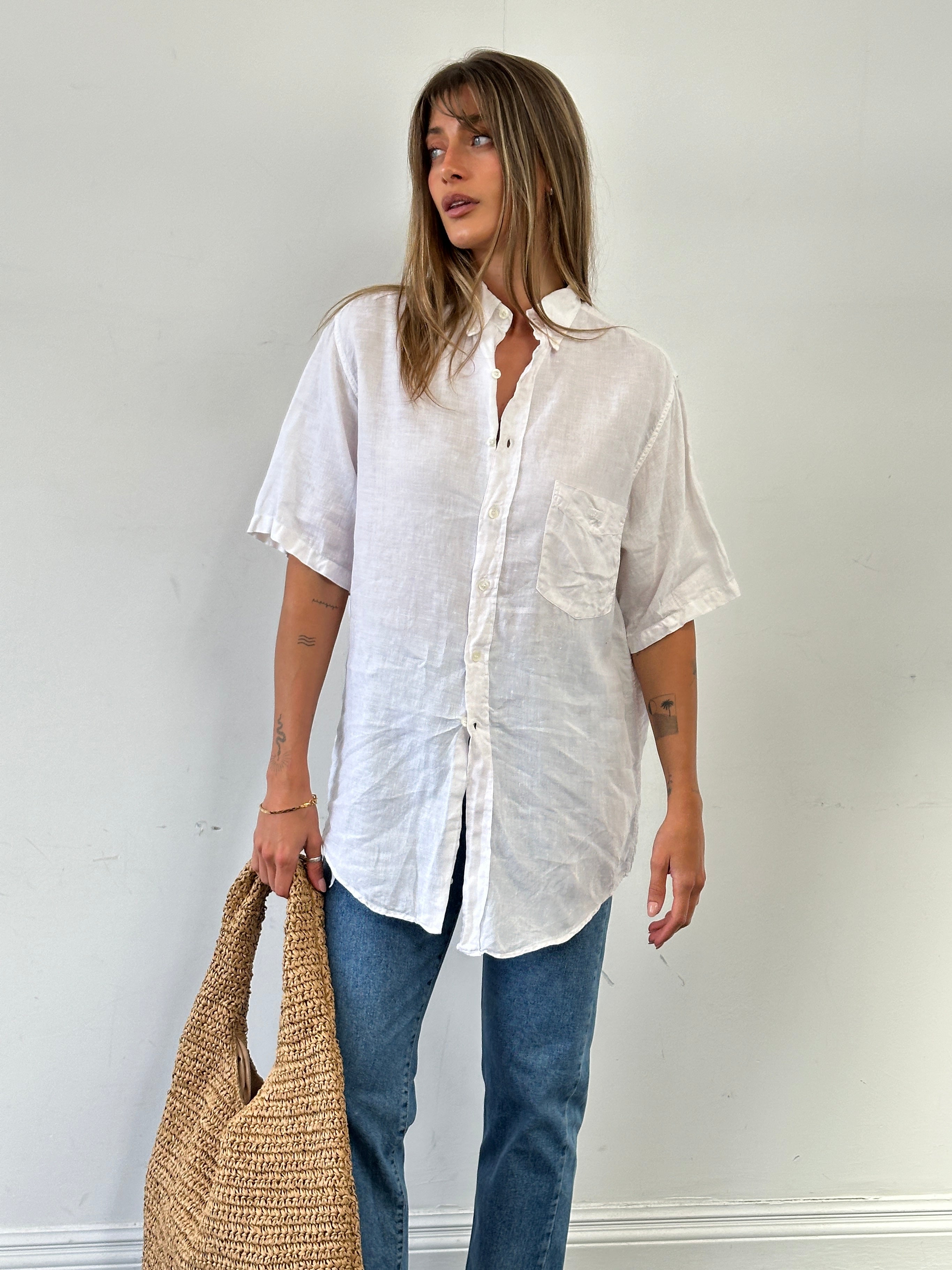 Moschino pure linen logo short sleeve shirt in size L/XL, featuring a classic design with the iconic logo on the front.