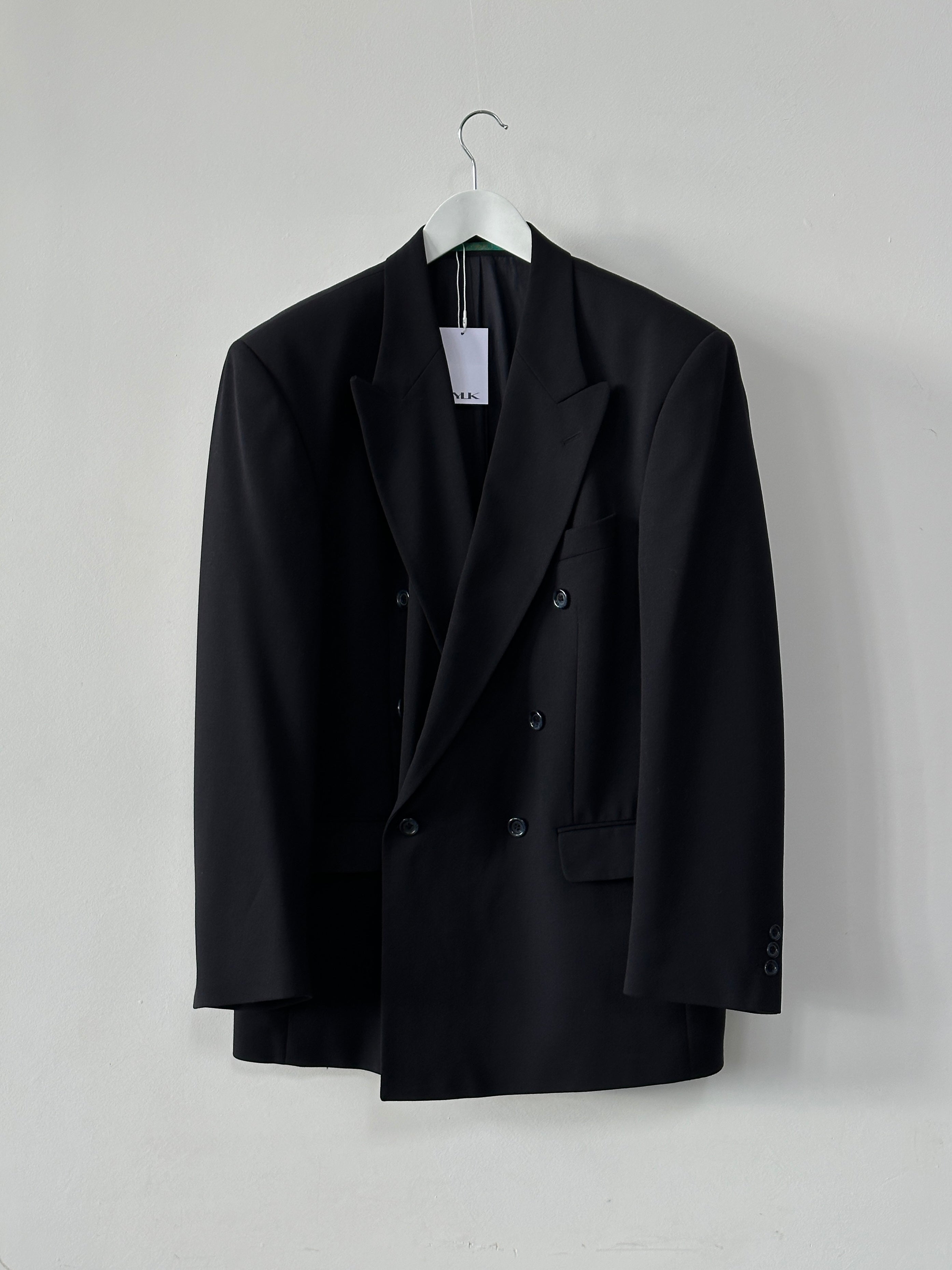 Vintage double-breasted wool blazer in XL size, featuring classic tailoring and a textured fabric, suitable for stylish formal or casual wear.