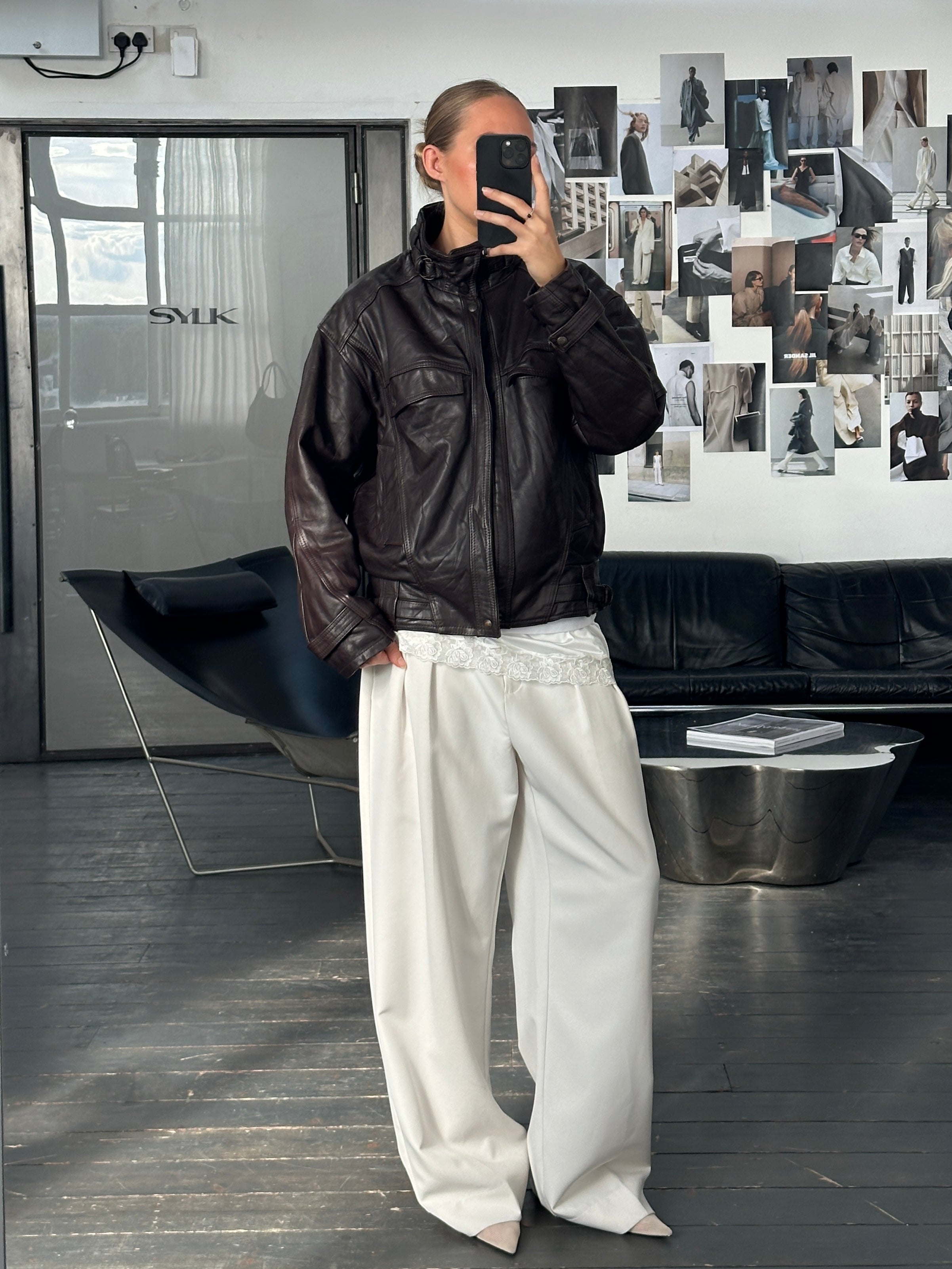 Vintage French 1980s high neck leather bomber jacket, size L, showcasing classic vintage style and textured leather details.