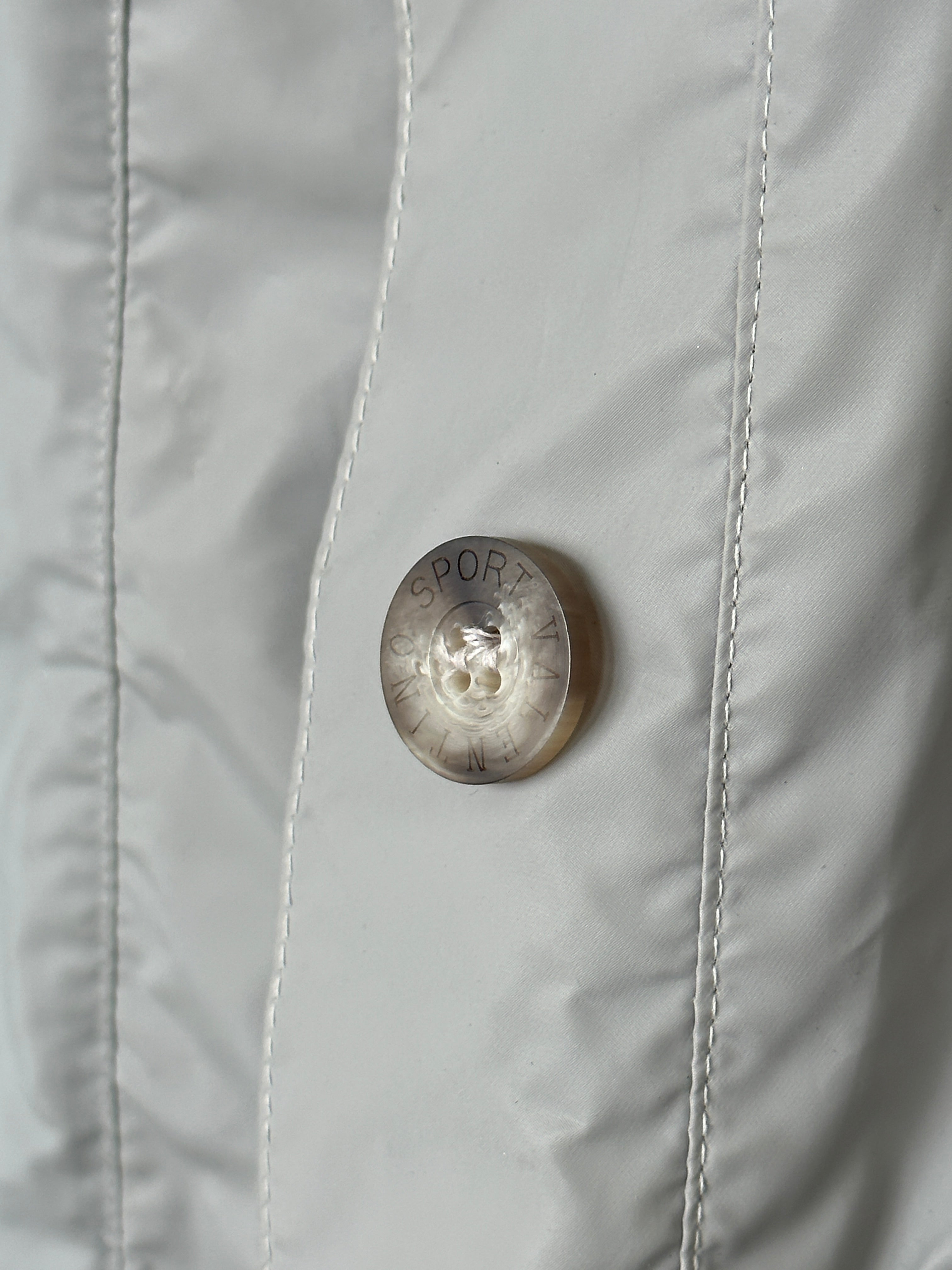 Valentino Sport raincoat jacket in size large, stylish waterproof outerwear with a sleek design and Valentino branding.