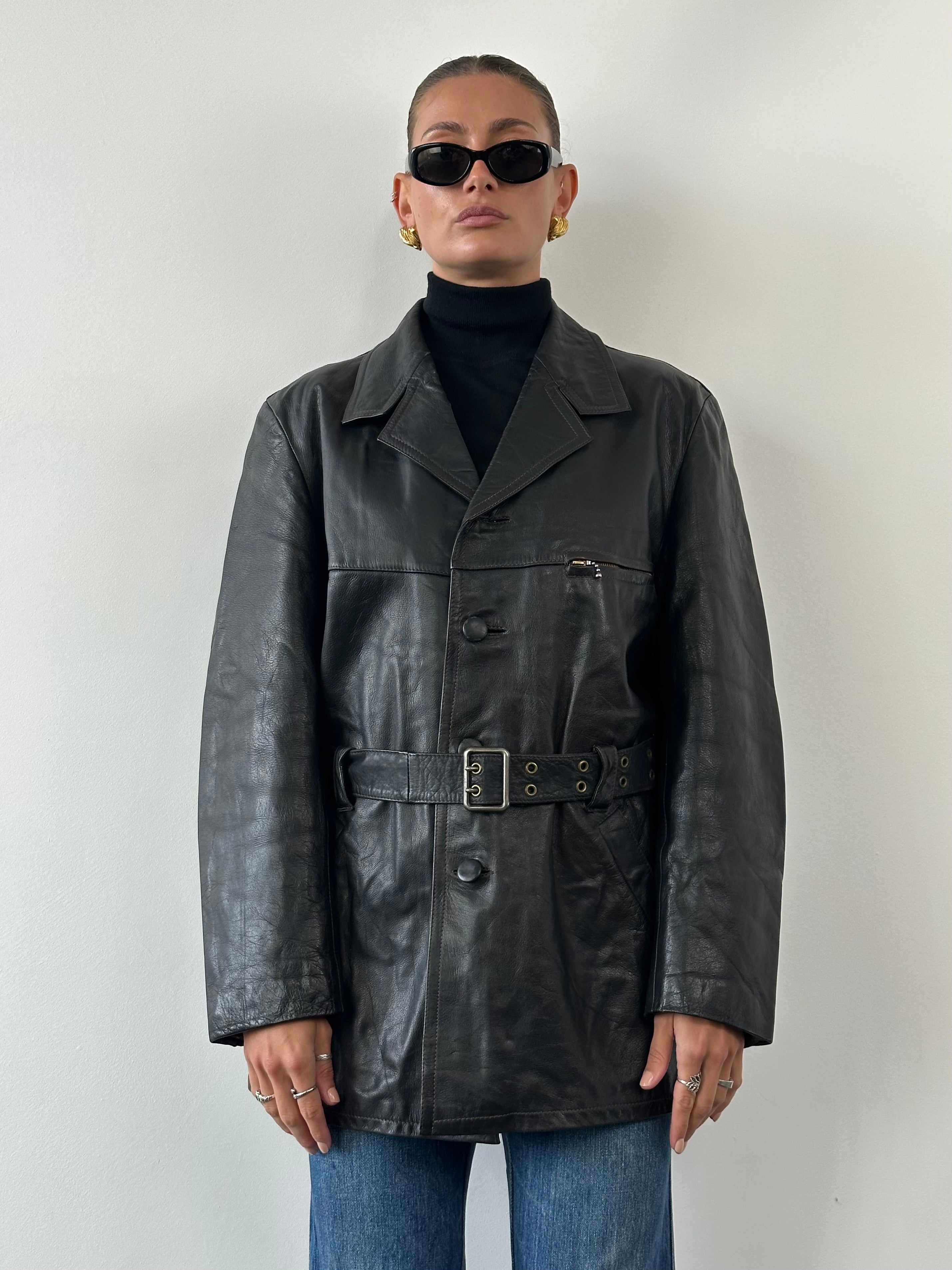 Vintage belted leather jacket in XL, featuring classic design, leather texture, and stylish front belt detail.