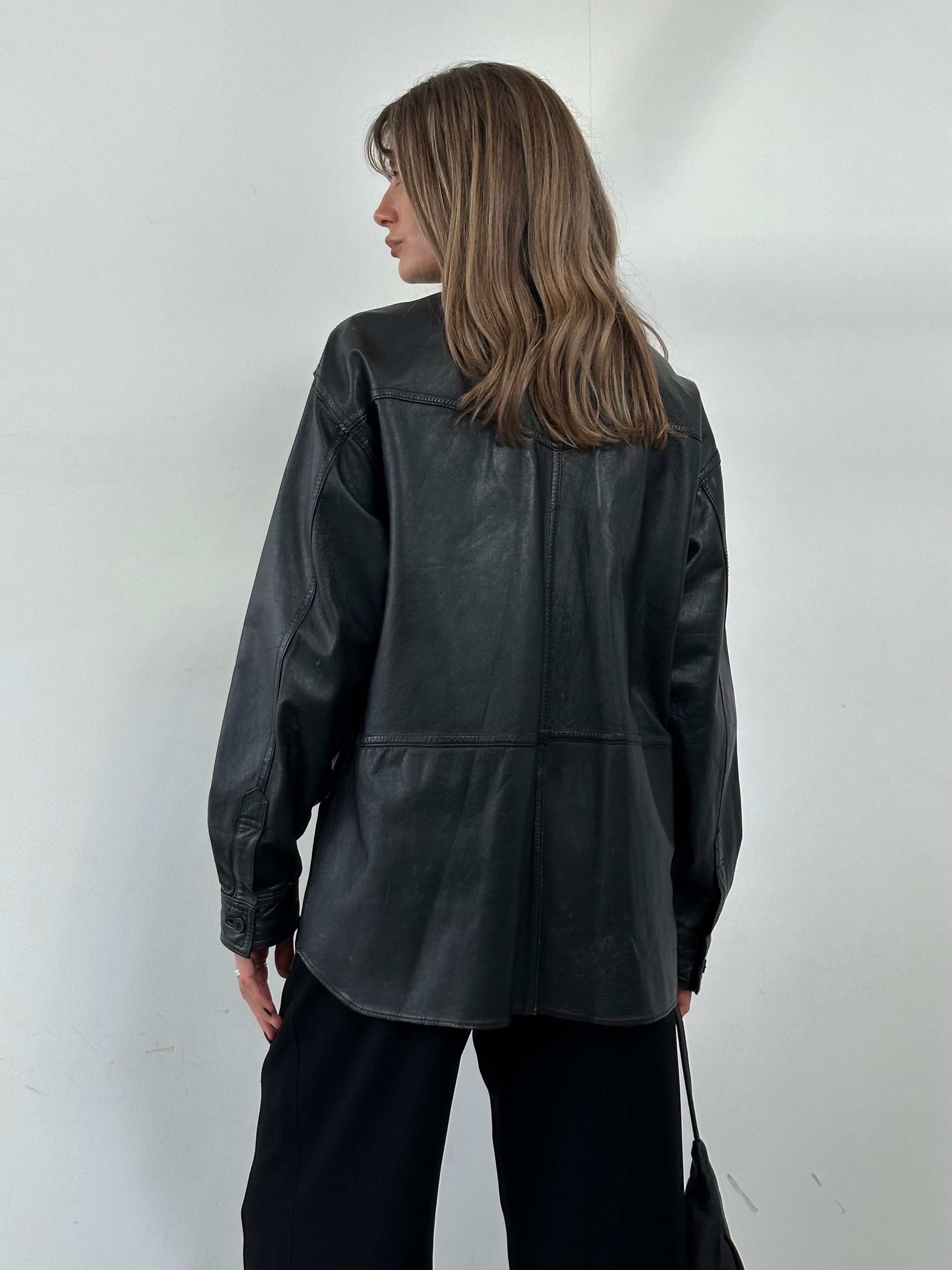 Vintage leather shirt in size L/XL, featuring a classic design with detailed stitching and a rugged, timeless look.