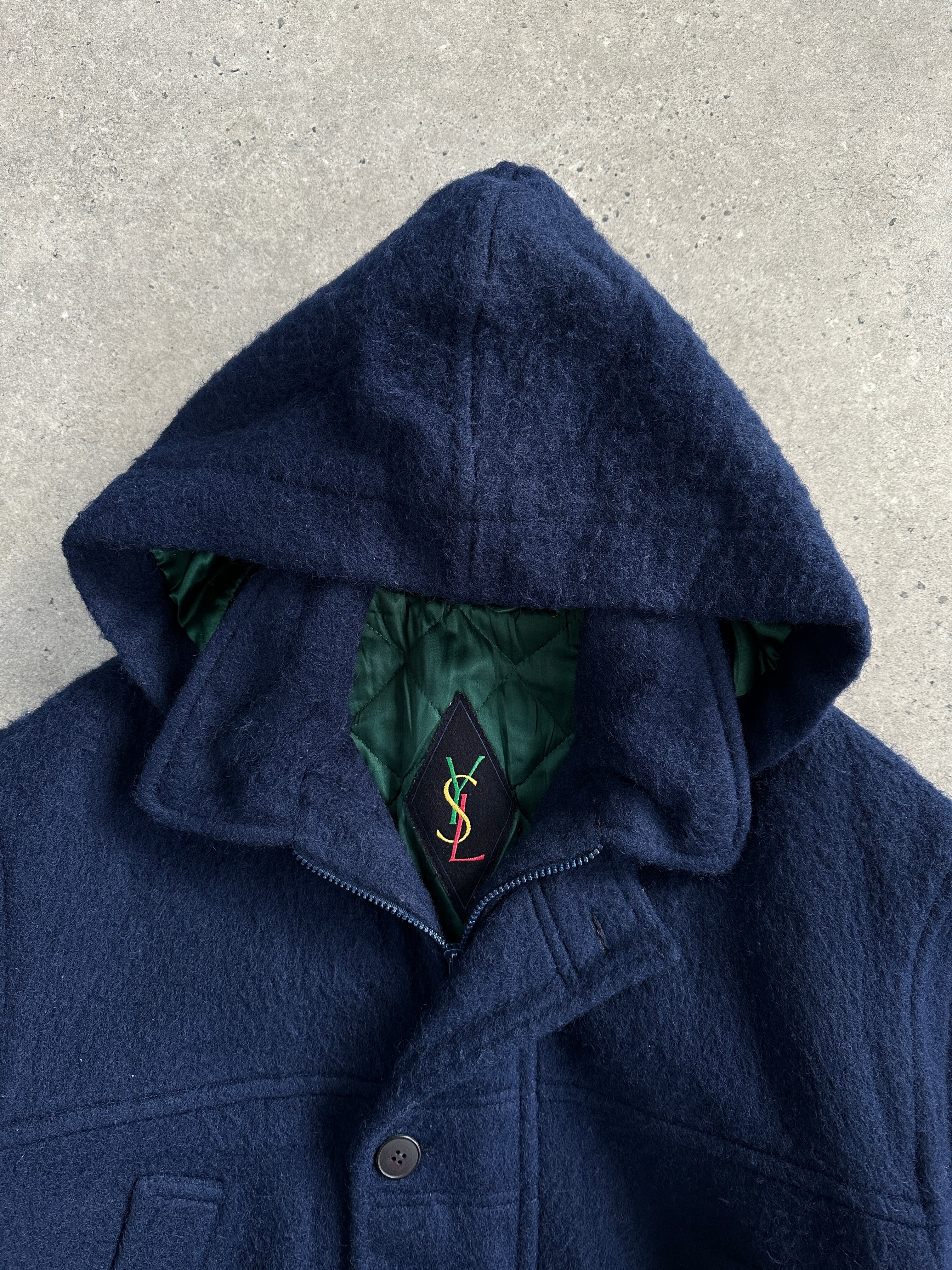 Yves Saint Laurent 1980s pure wool hooded coat in XL/XXL, with classic design and tailored fit, shown on a hanger.