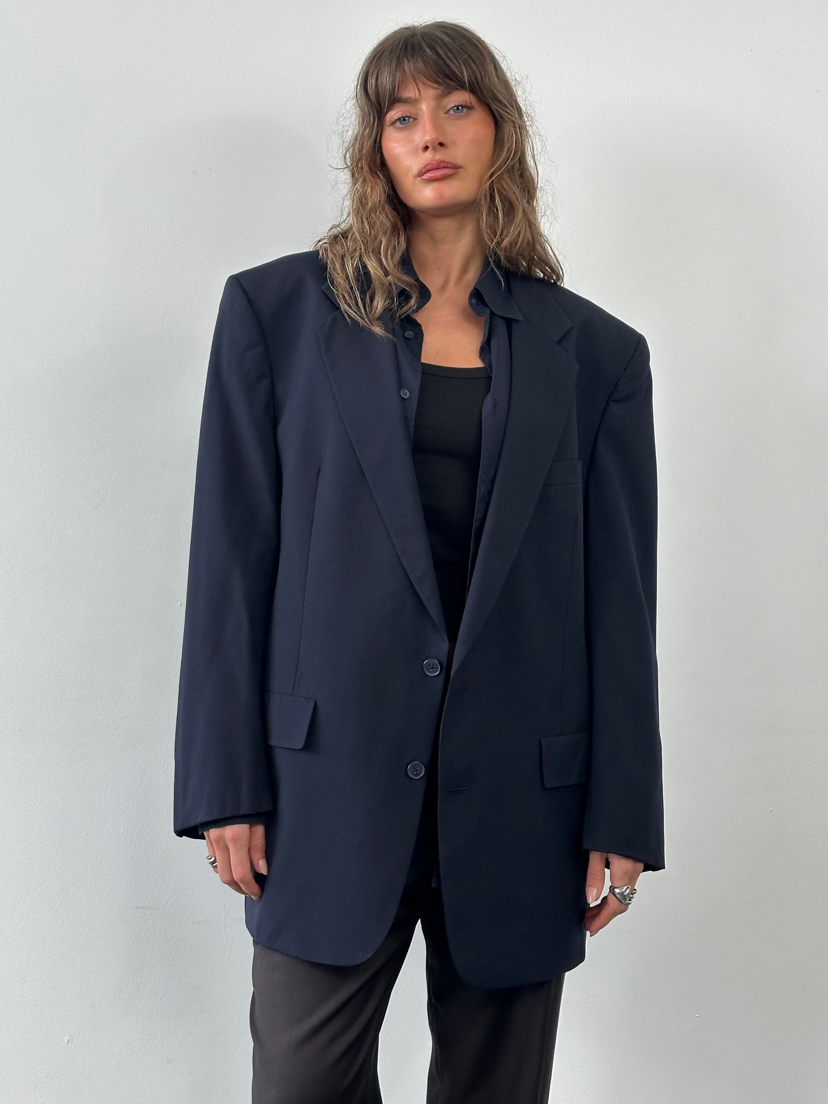 Christian Dior Monsieur 1980s pure wool single-breasted blazer in size 48L/XXL, shown on a hanger with a tailored fit and classic lapel.