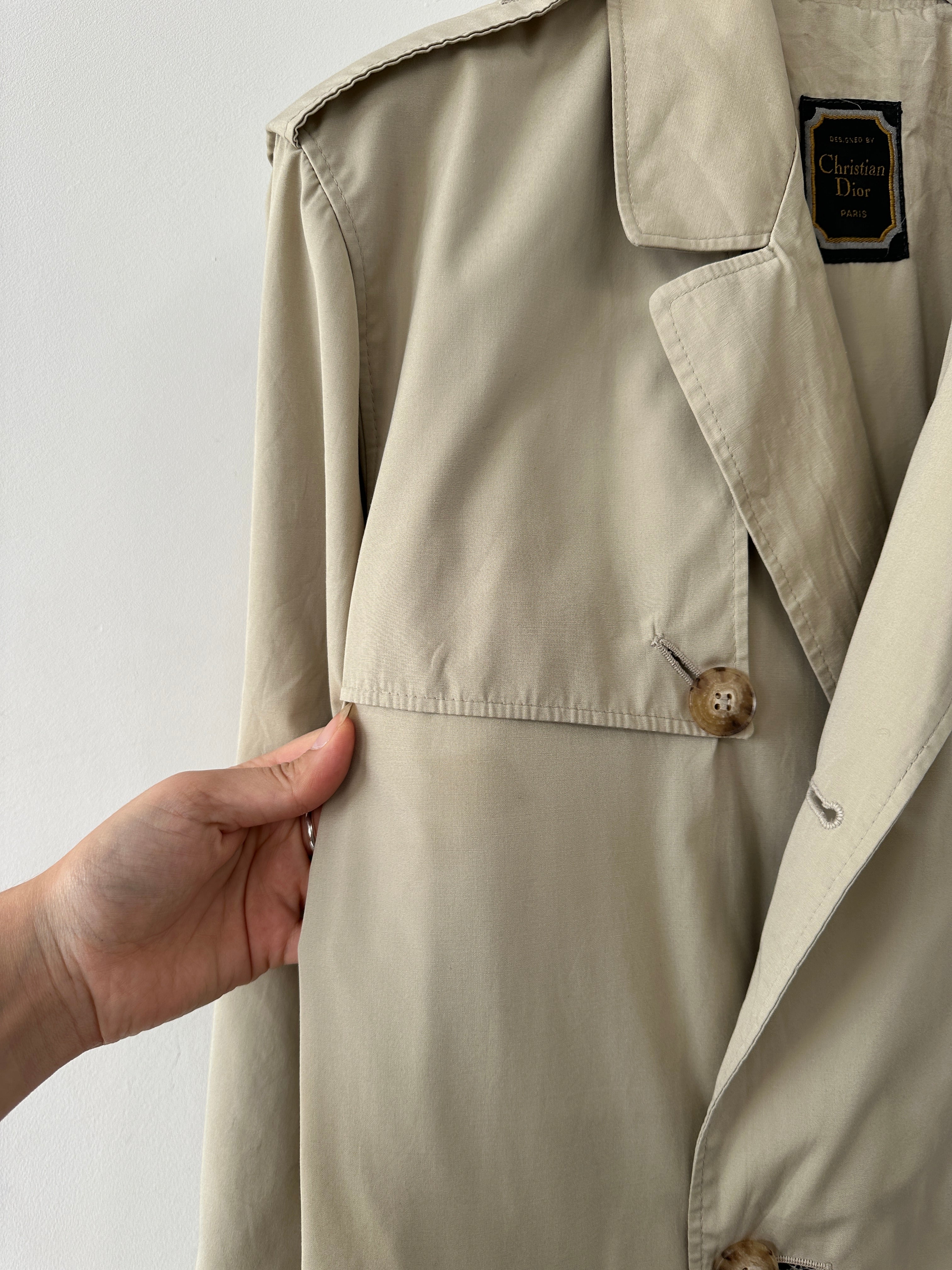 Christian Dior Paris cotton double-breasted belted trench coat in beige, size 40R/XL, with classic collar and button detailing.