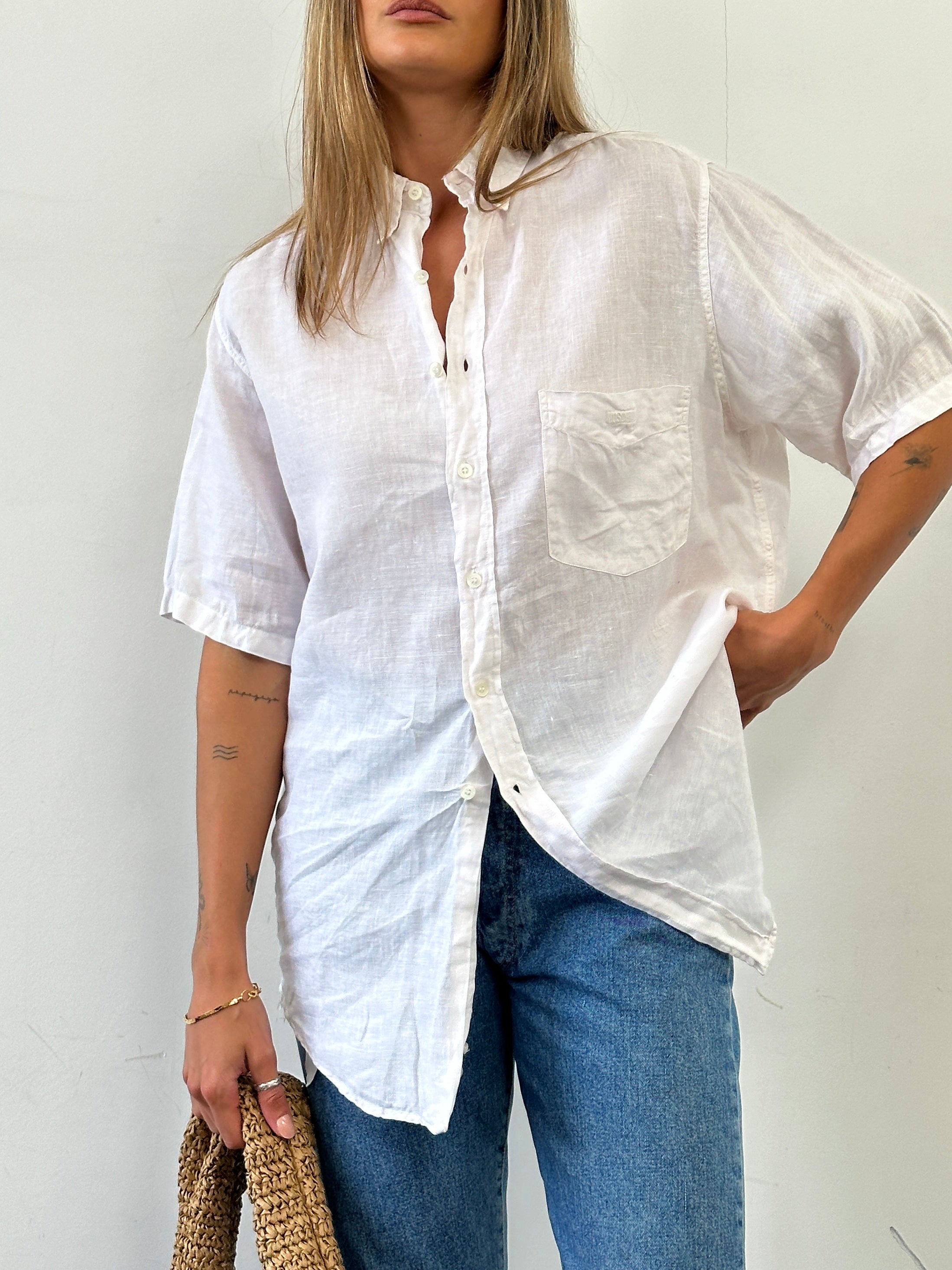 Moschino pure linen logo short sleeve shirt in size L/XL, featuring a classic design with the Moschino logo on the front.
