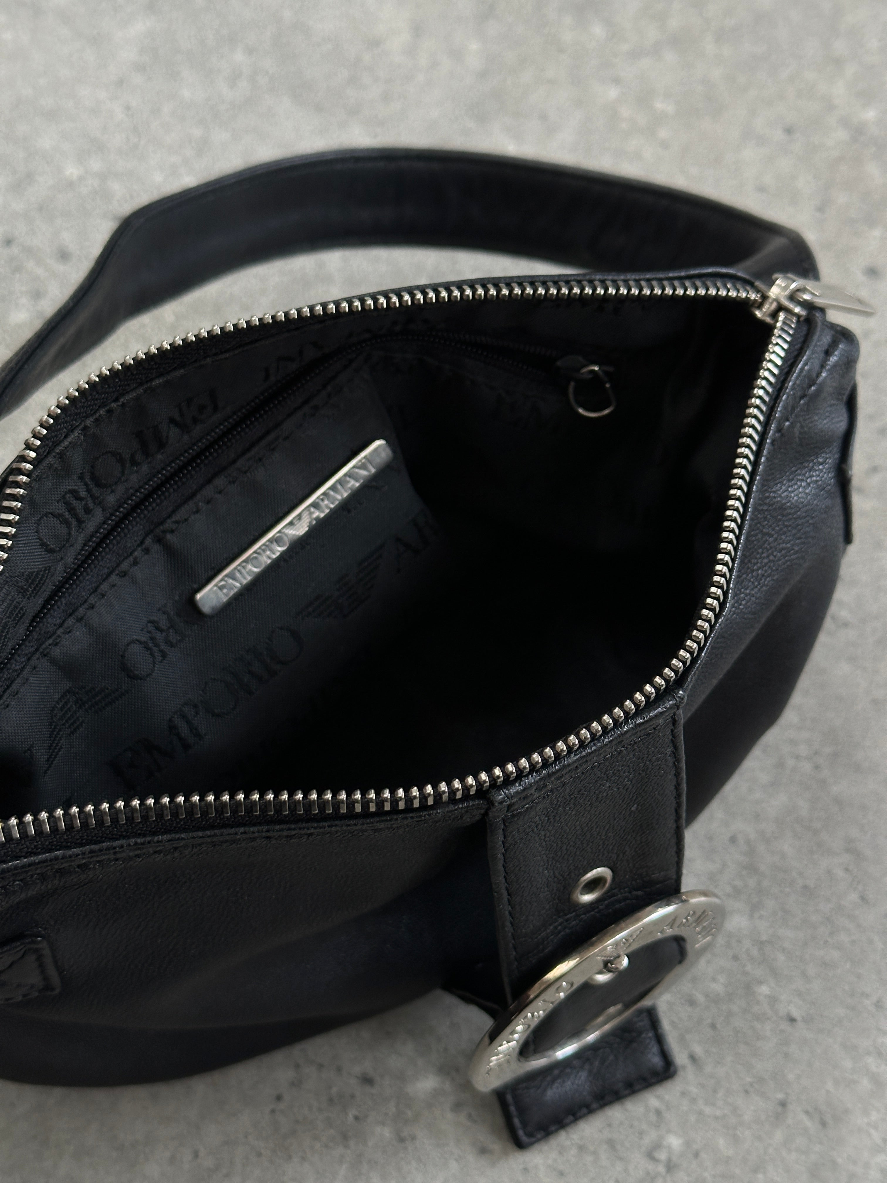 Emporio Armani leather shoulder bag with adjustable strap, sleek design, and subtle logo detailing.