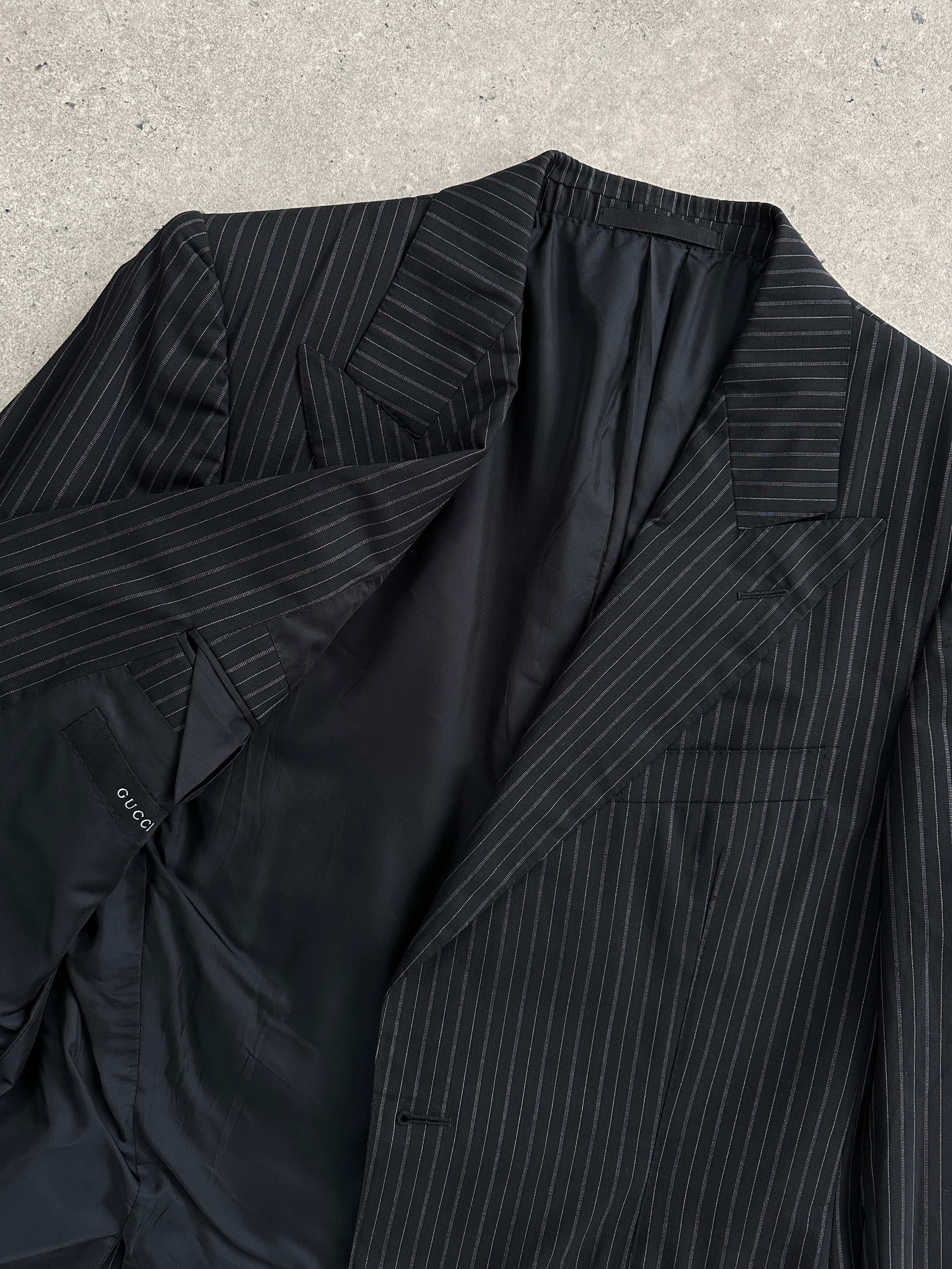 Gucci wool stripe dagger collar blazer in black and white, tailored fit, featuring signature Gucci design details.