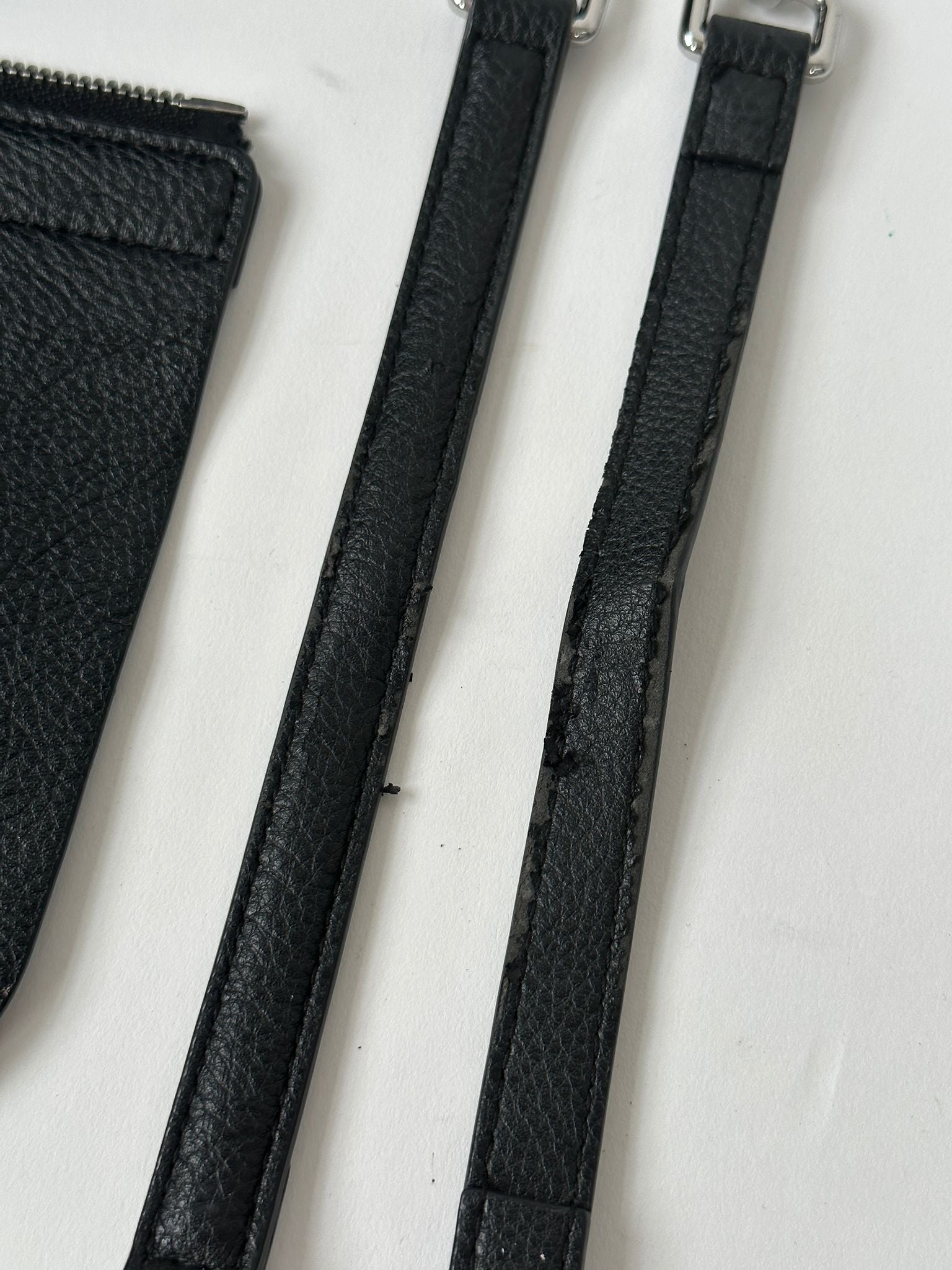 Tommy Hilfiger crossbody bag with adjustable strap, navy fabric, and iconic logo detail visible on the front.