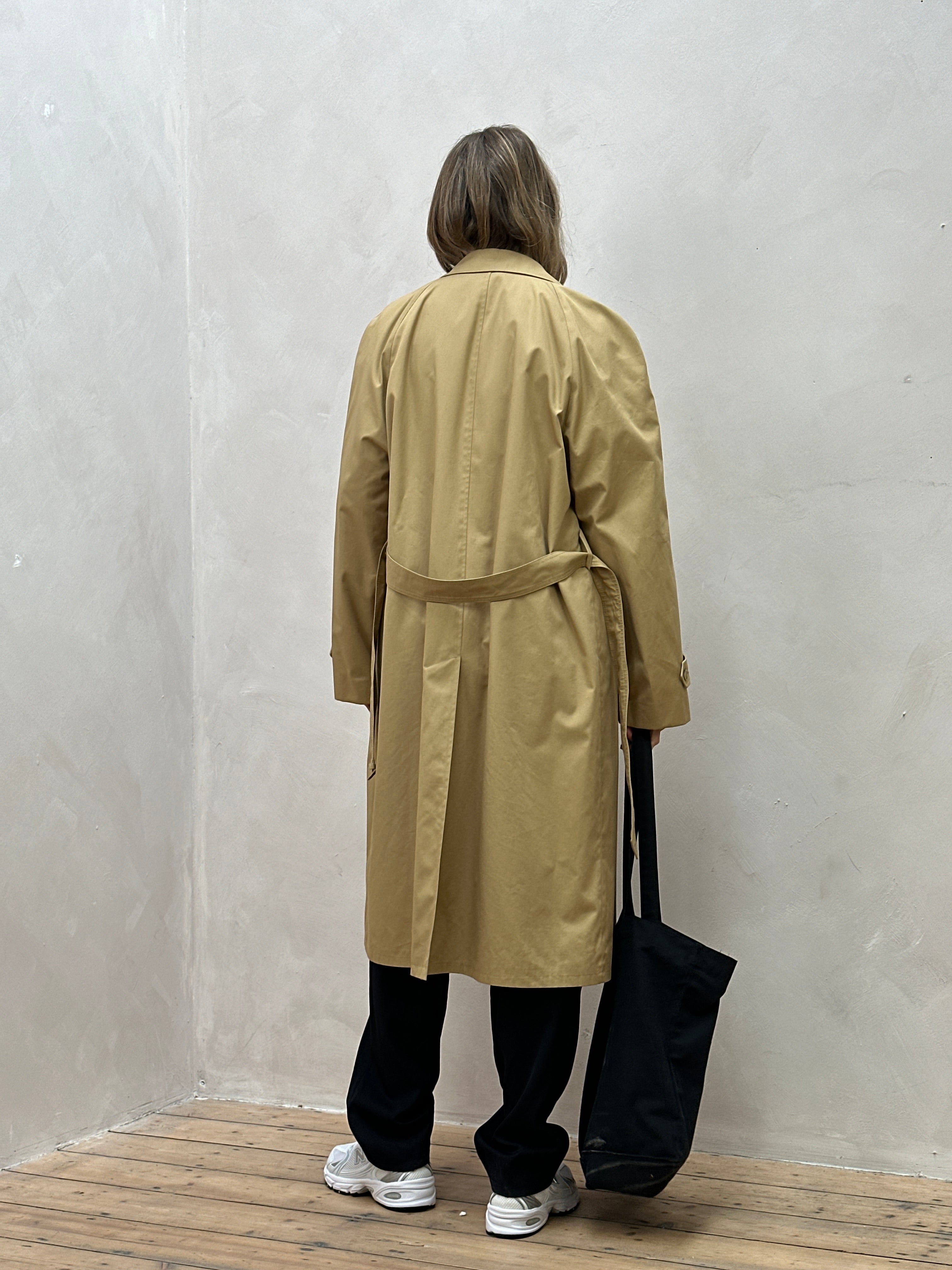Vintage oversized trench coat with concealed placket, belted waist, in classic style, shown in XL size with detailed fabric texture.