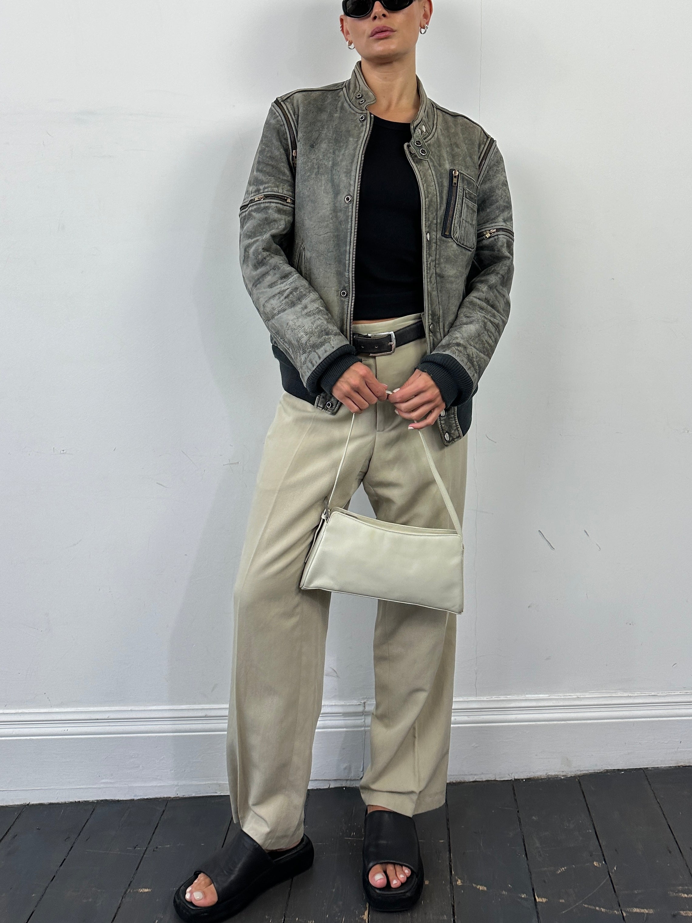 Vintage leather bomber jacket in aged 3-in-1 design, medium size, featuring distressed brown leather and classic bomber style.