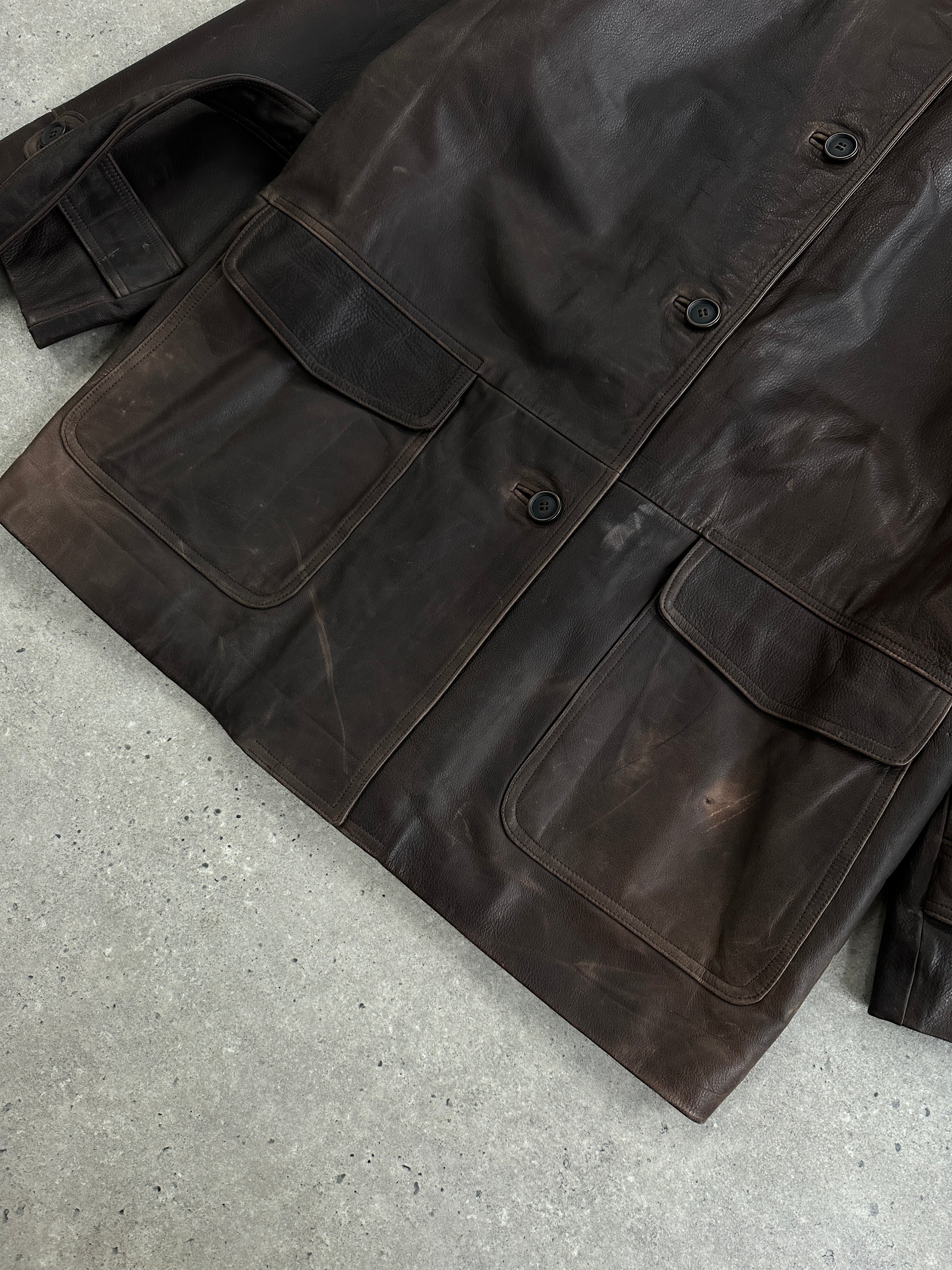 Italian vintage 1990s belted leather jacket in XL, featuring aged leather and classic design from the Vintage brand.