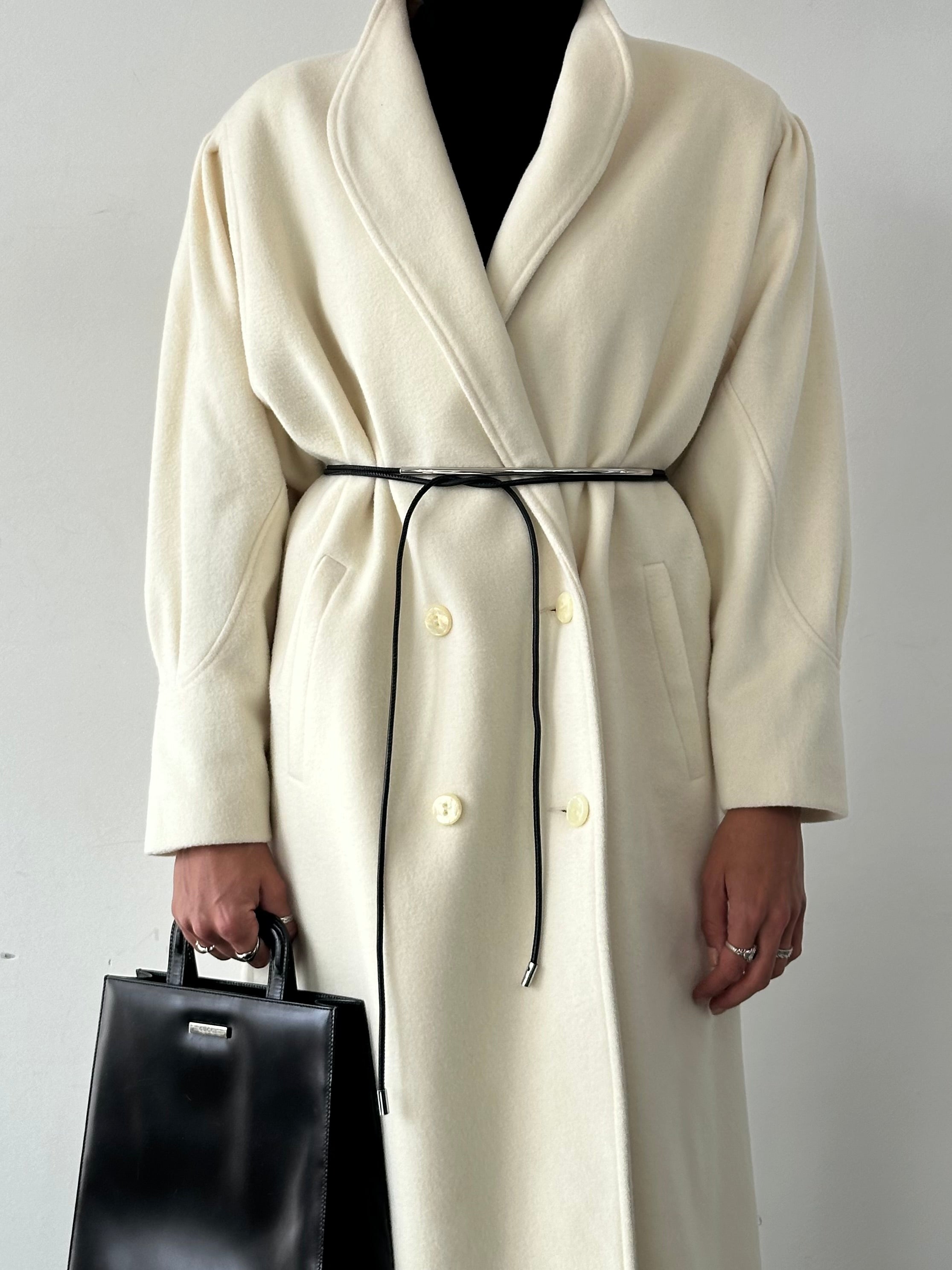 Vintage pure wool double-breasted coat in size L/XL, featuring classic design and tailored fit, shown on a hanger.
