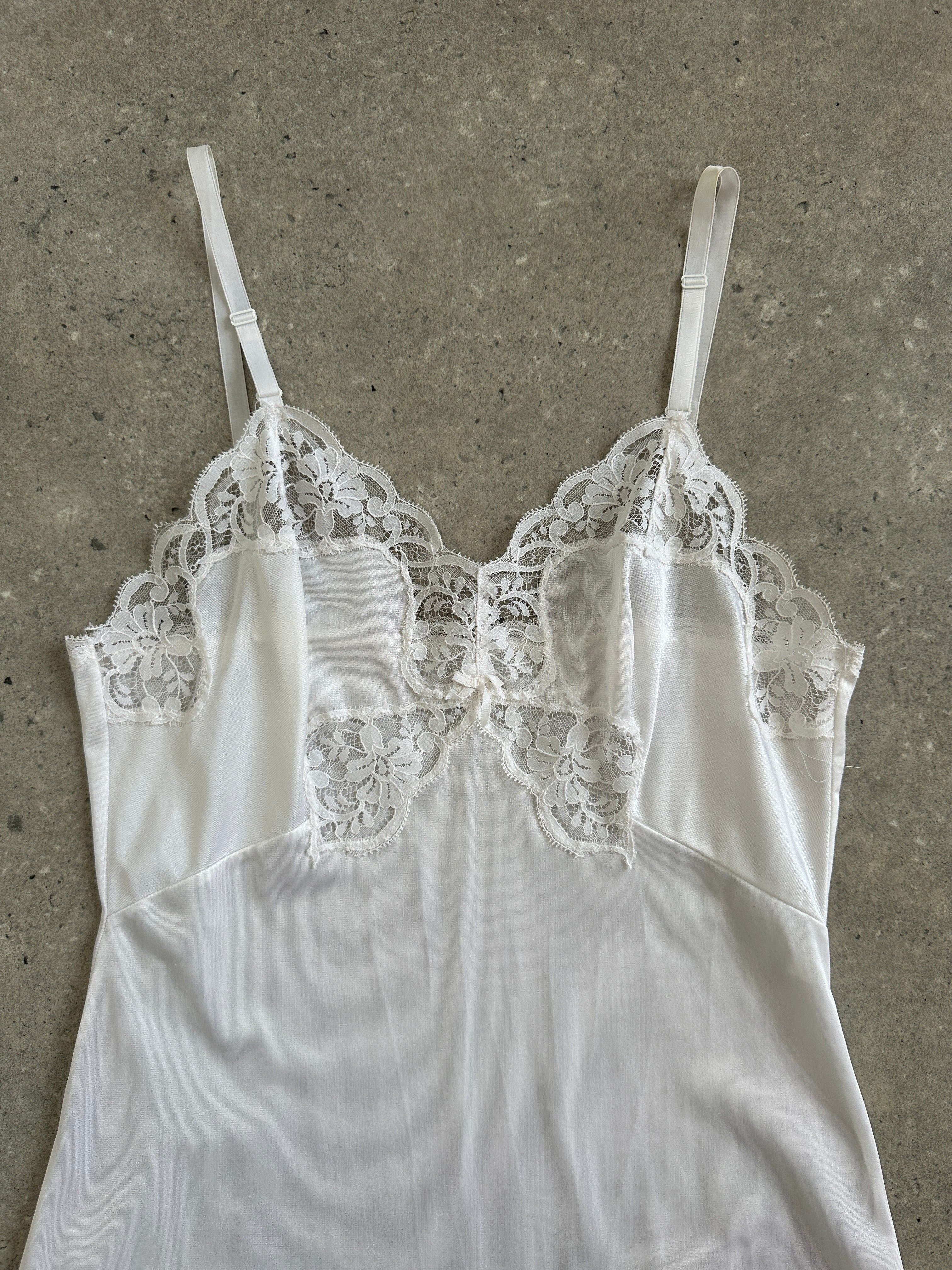 Vintage 1990s lace sheer mini slip dress in XS, featuring delicate lace details and a vintage-inspired style.