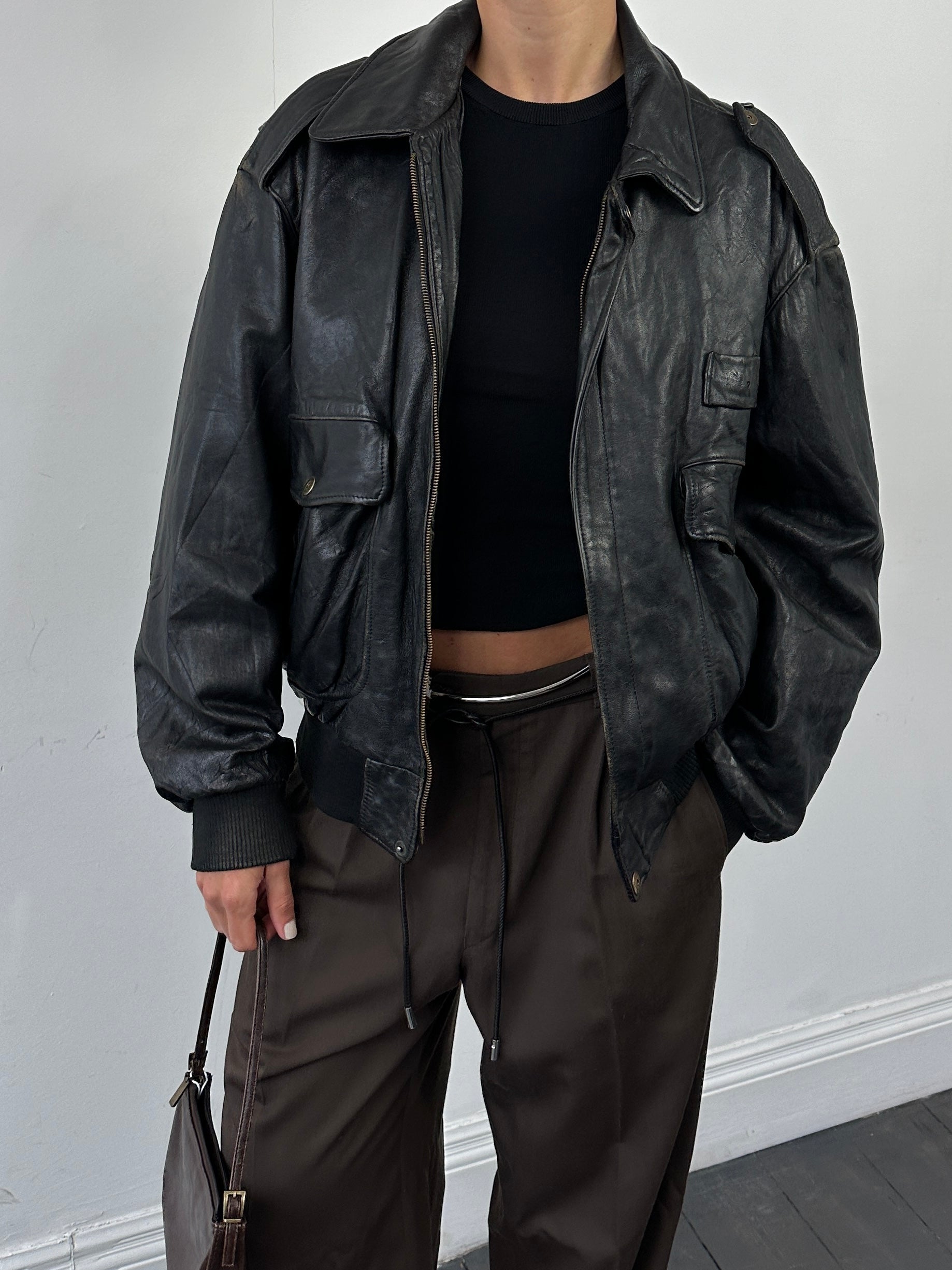 Vintage Italian leather bomber jacket with removable fleece lining, size large, featuring classic design and detailed stitching.