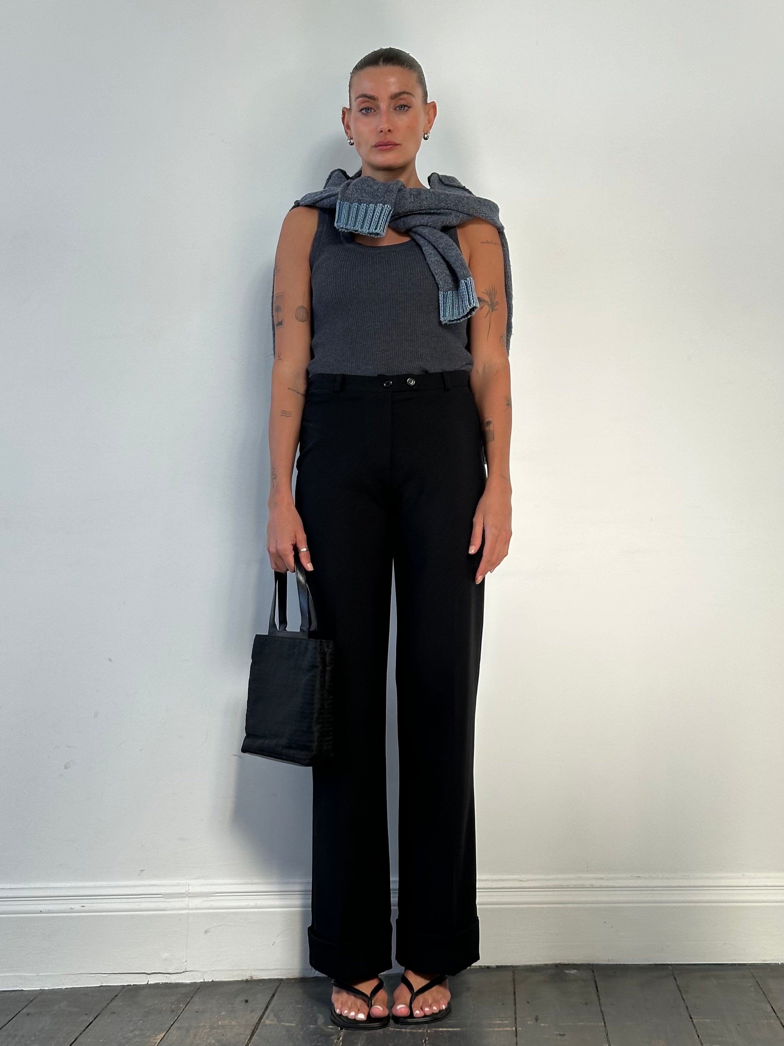 Vintage Italian mid-waisted straight leg tailored trousers in classic fabric, size W28, shown on a hanger.