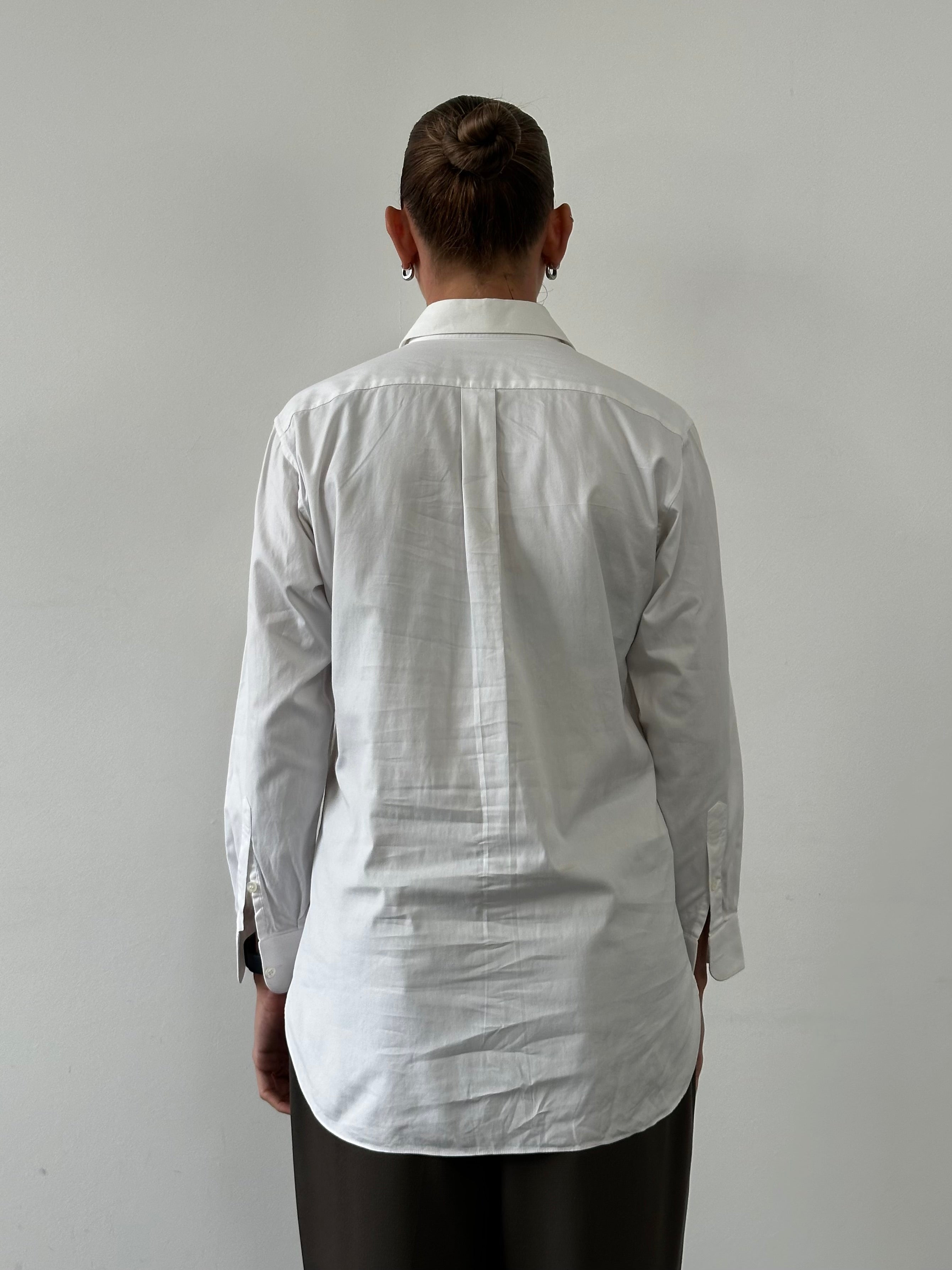 Christian Dior Monsieur cotton logo shirt in size S/M, featuring the Dior branding and classic design, displayed on a hanger.
