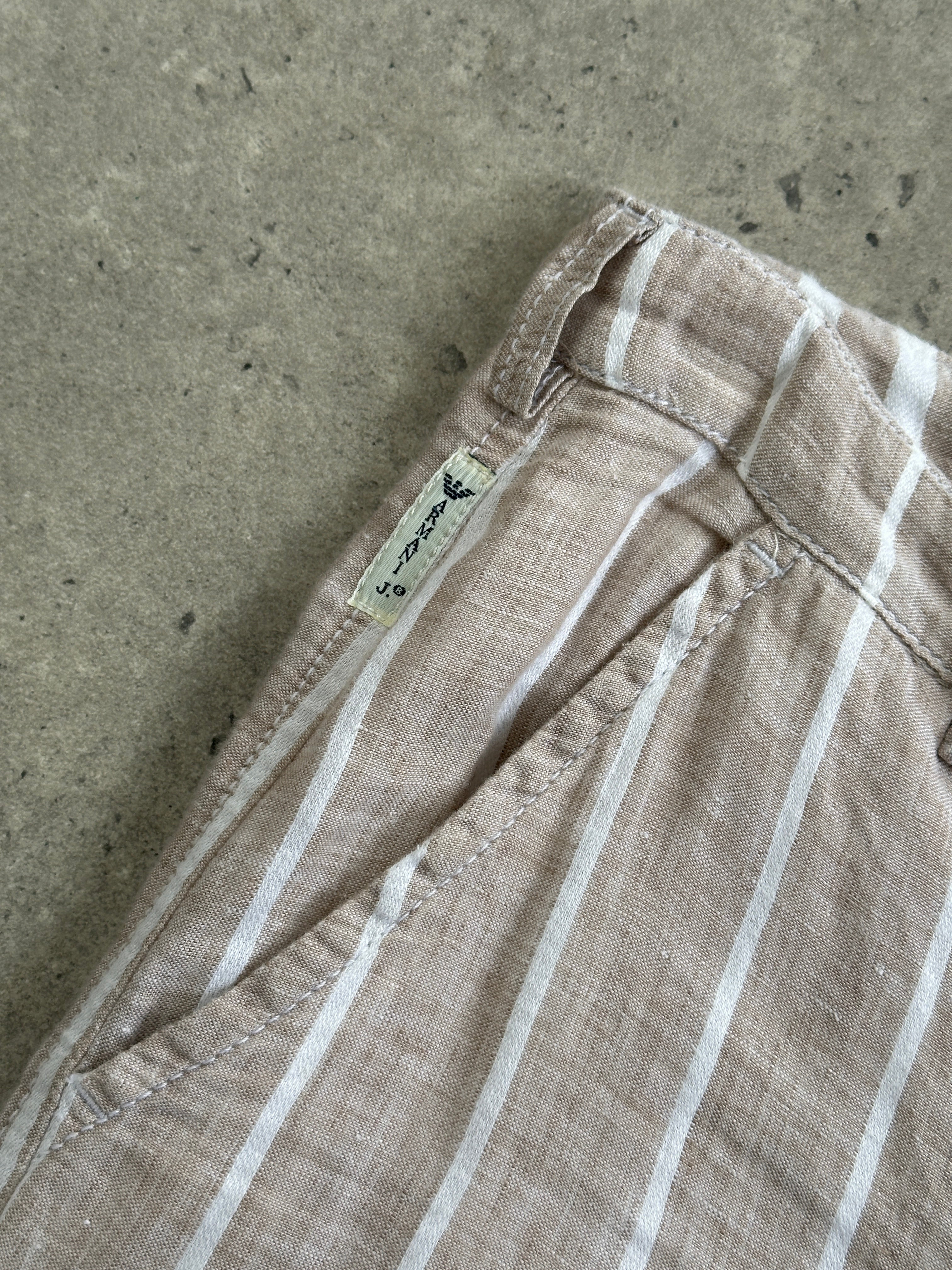 Armani Jeans wide-leg linen trousers with mid-rise fit and stripe pattern, size W30, styled on a model.
