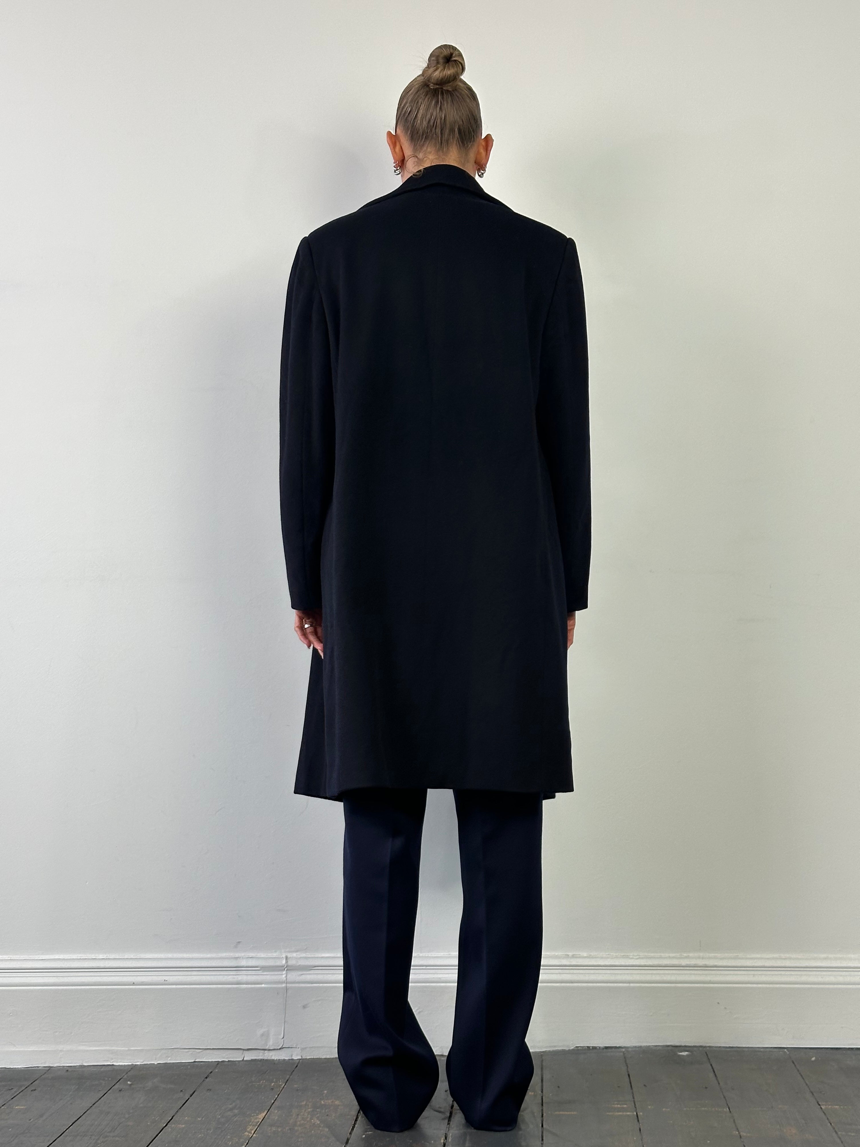 Loro Piana pure wool double-breasted coat in size L/XL, featuring classic design and tailored fit, displayed on a neutral background.