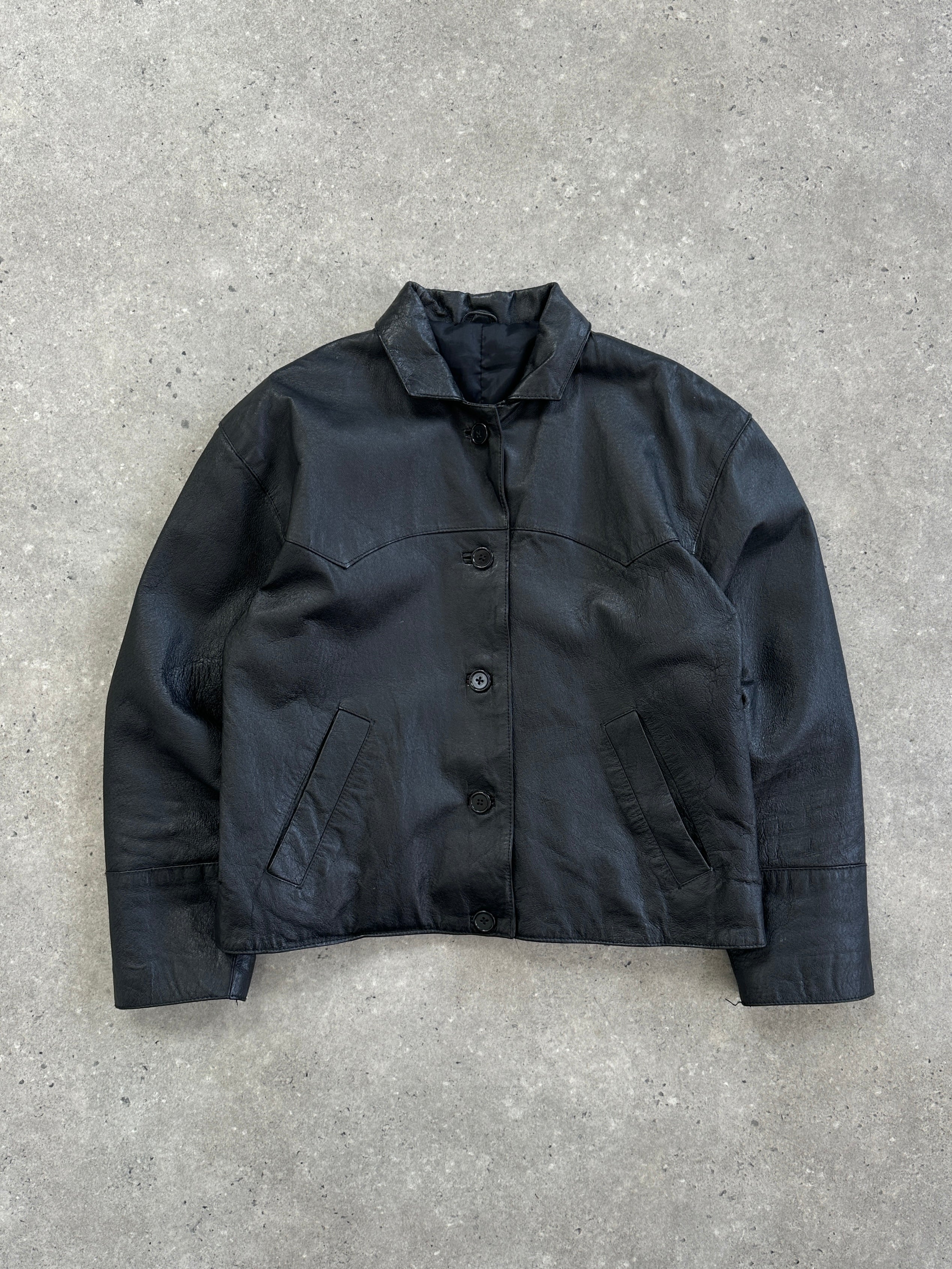 Vintage leather jacket, cropped style for women, in size small, featuring classic vintage design and authentic leather material.