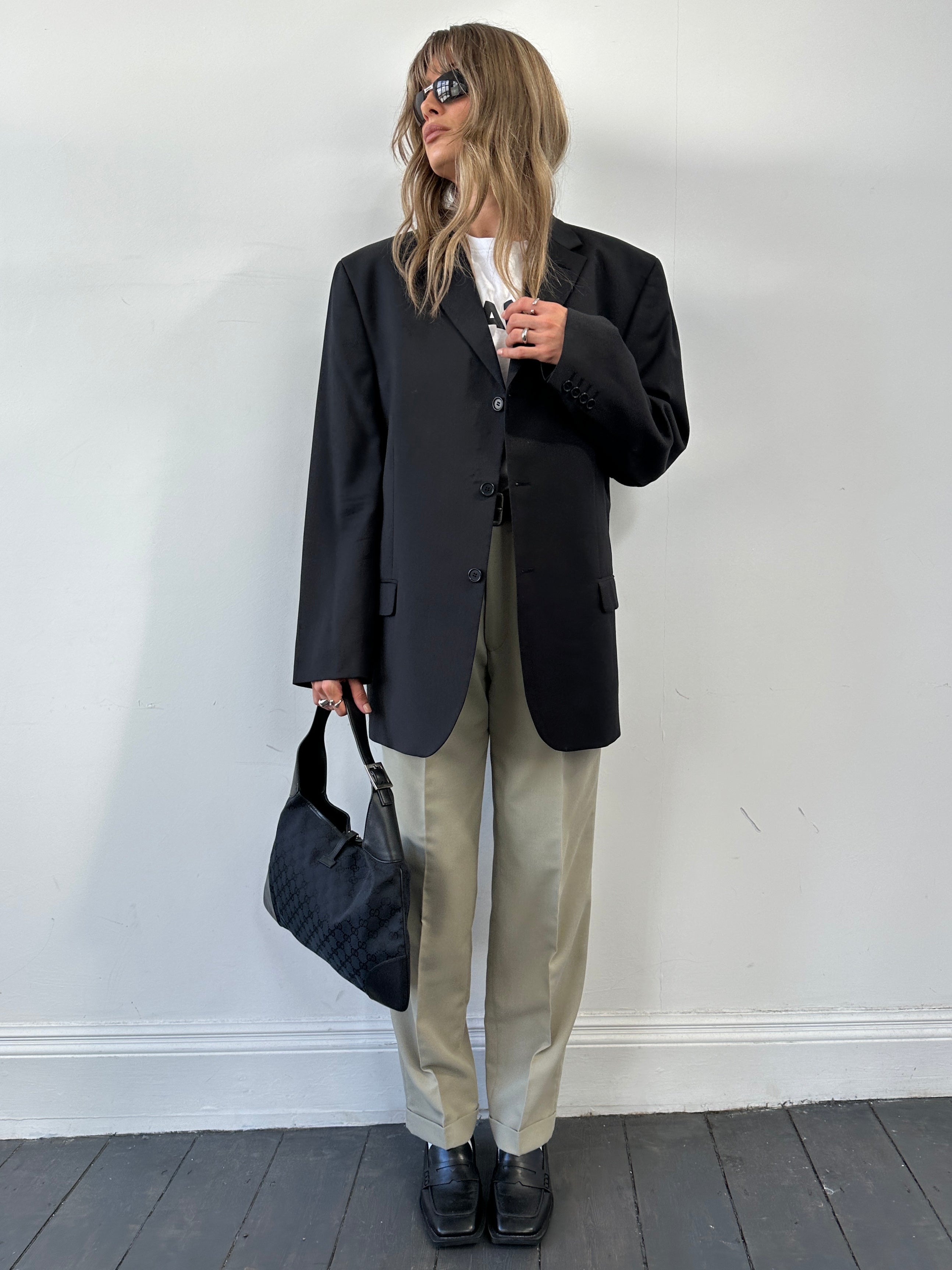 Pierre Cardin pure wool single-breasted blazer in size 44R/XL, tailored fit, dark color, displayed on a hanger.