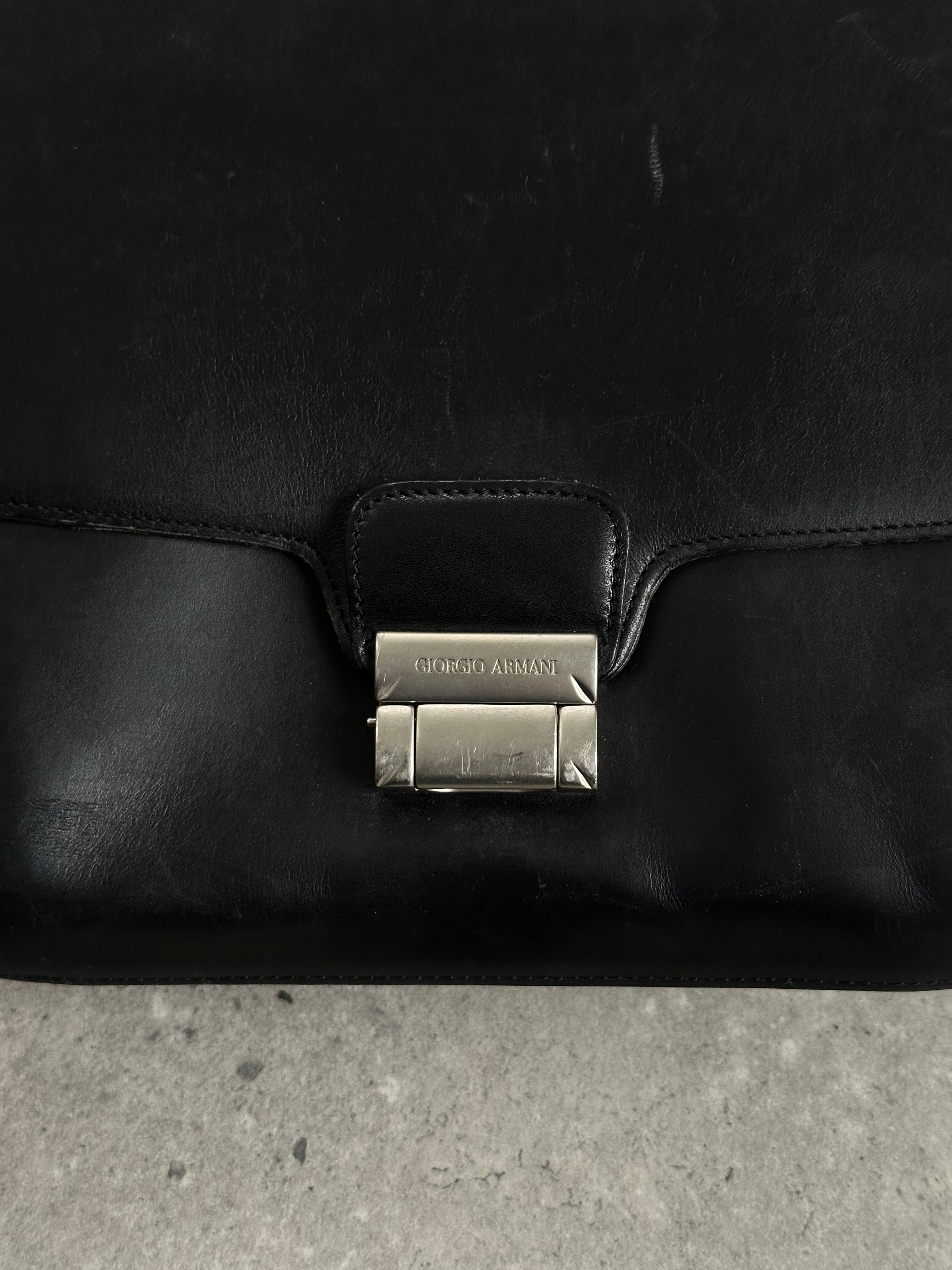 Giorgio Armani Le Collezioni leather crossbody bag with adjustable strap and classic design, perfect for stylish everyday use