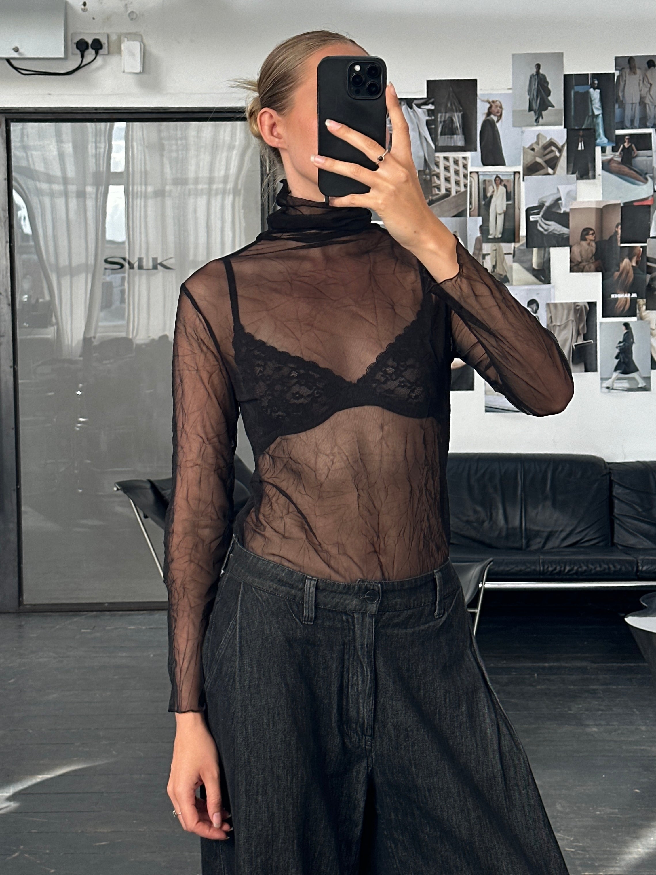 Vintage 2000s sheer crinkled roll neck tank top in black, with a fitted S/M style, displayed on a hanger.