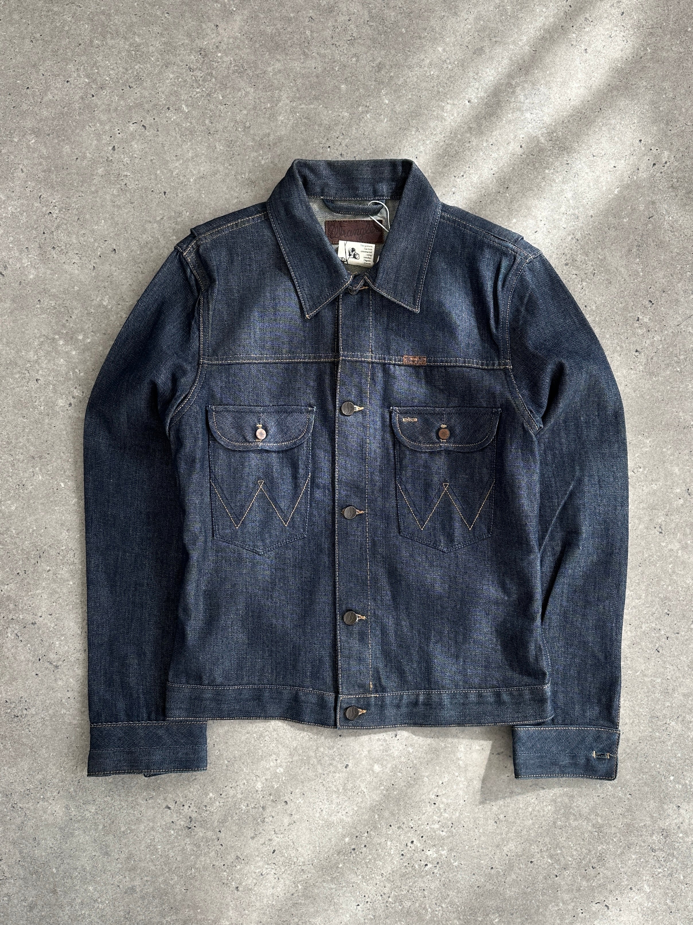 Wrangler organic cotton denim jacket in size S/M, showing classic blue denim with button front and chest pockets.